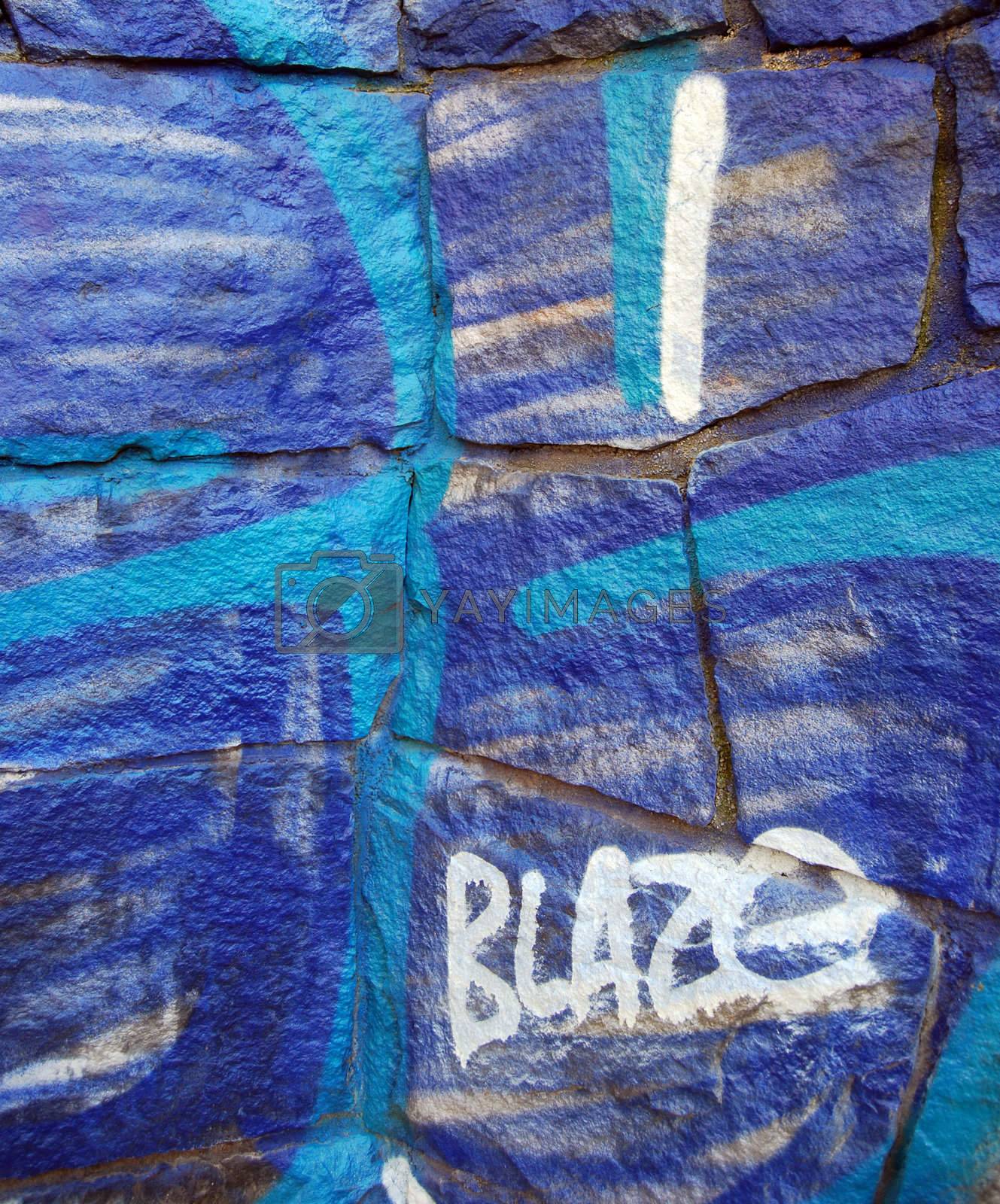 Royalty free image of Blue grafitti by windmill