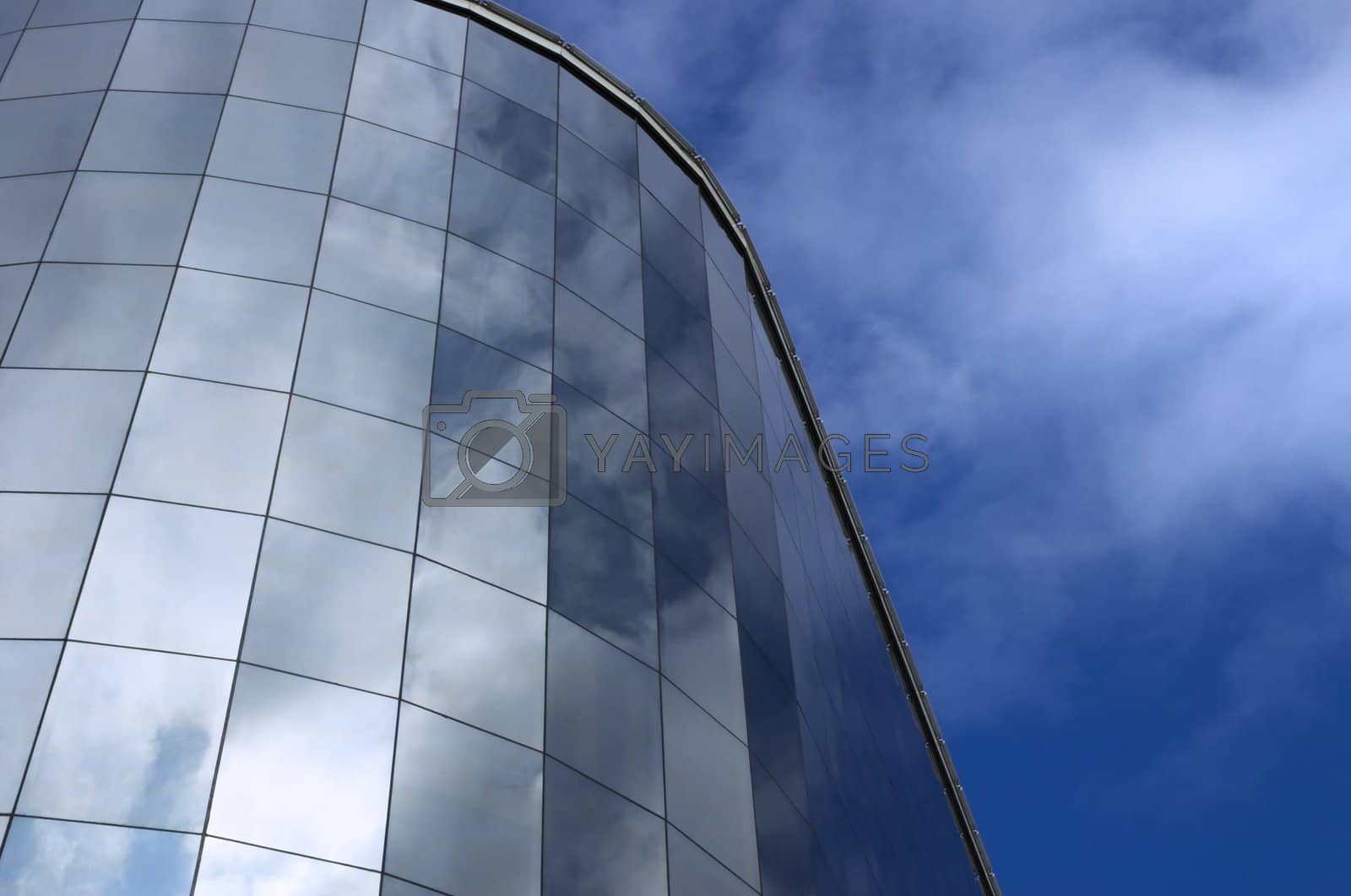 Royalty free image of modern building and sky reflection by Kuzma