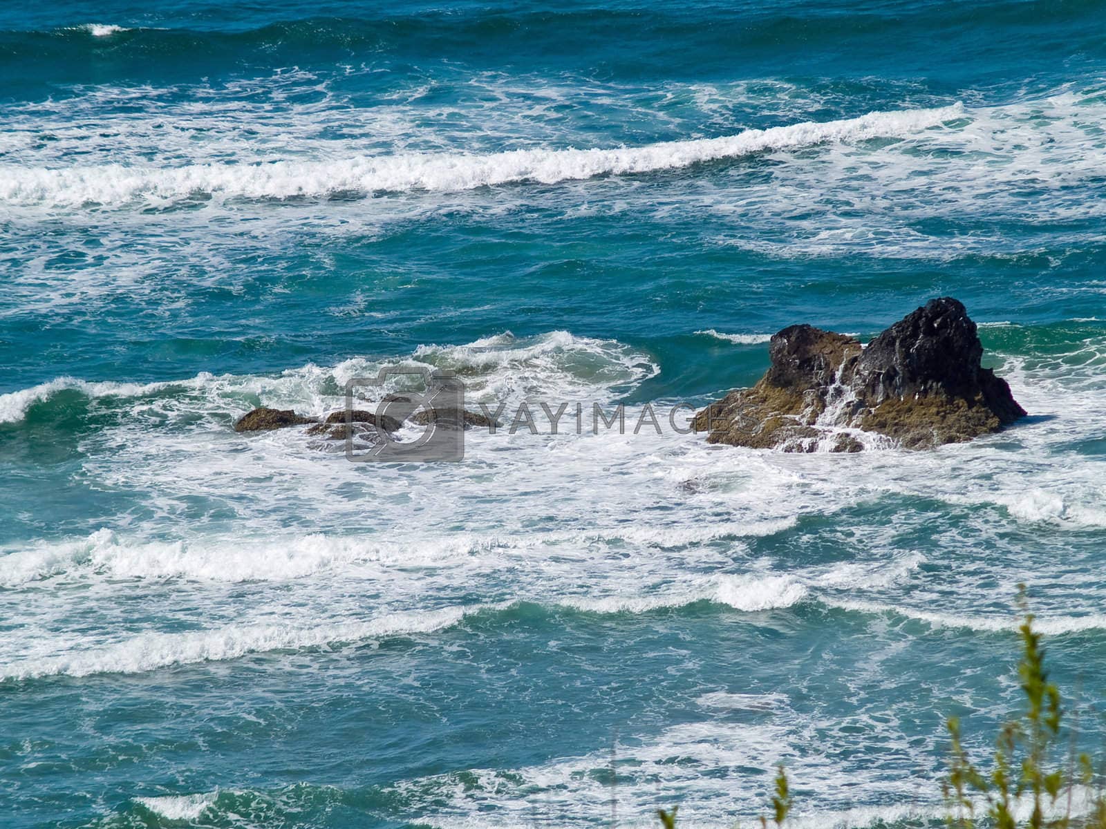 Royalty free image of Boulder on the Shore with Waves Crashing by Frankljunior