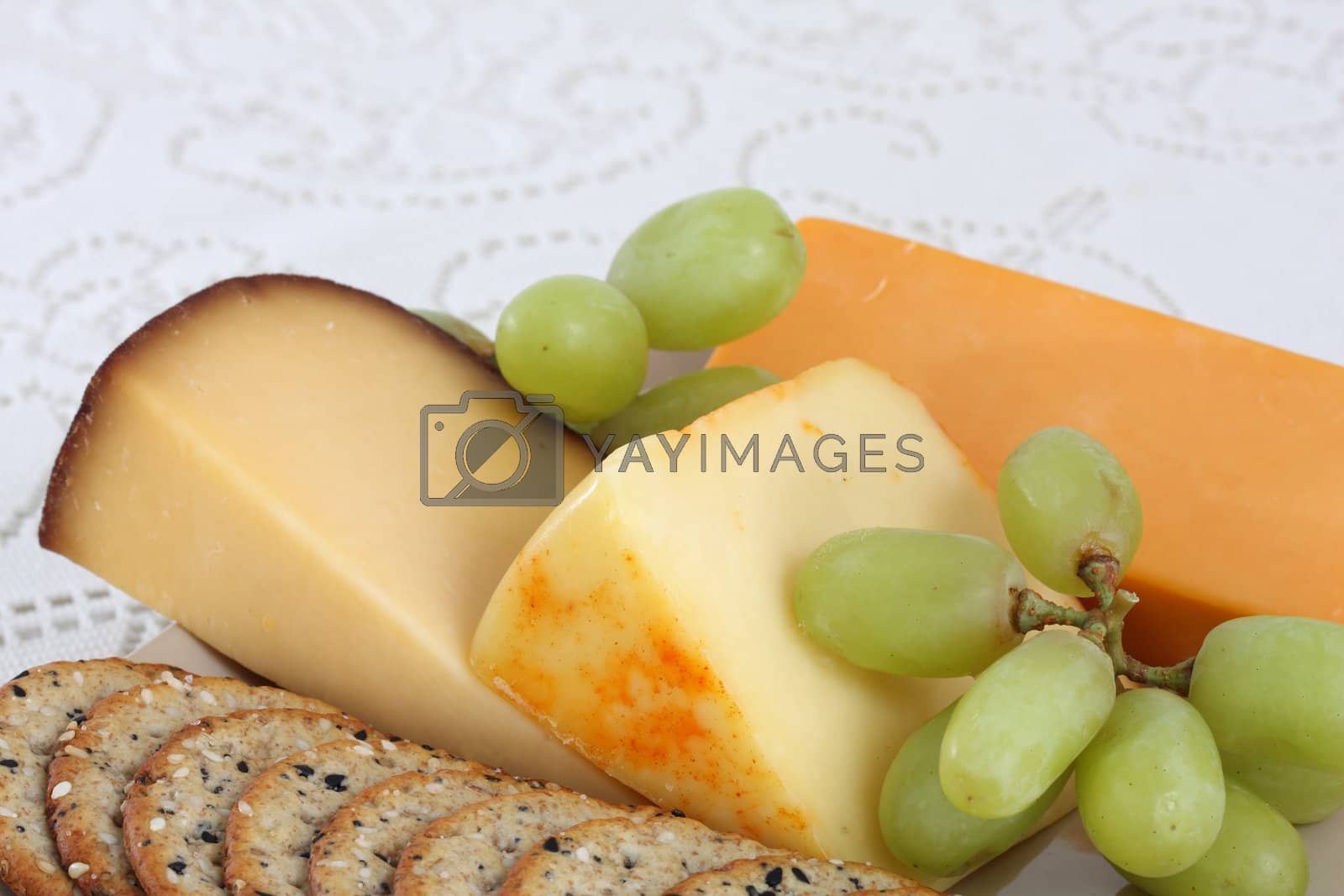 Royalty free image of cheese and crackers by teekaygee