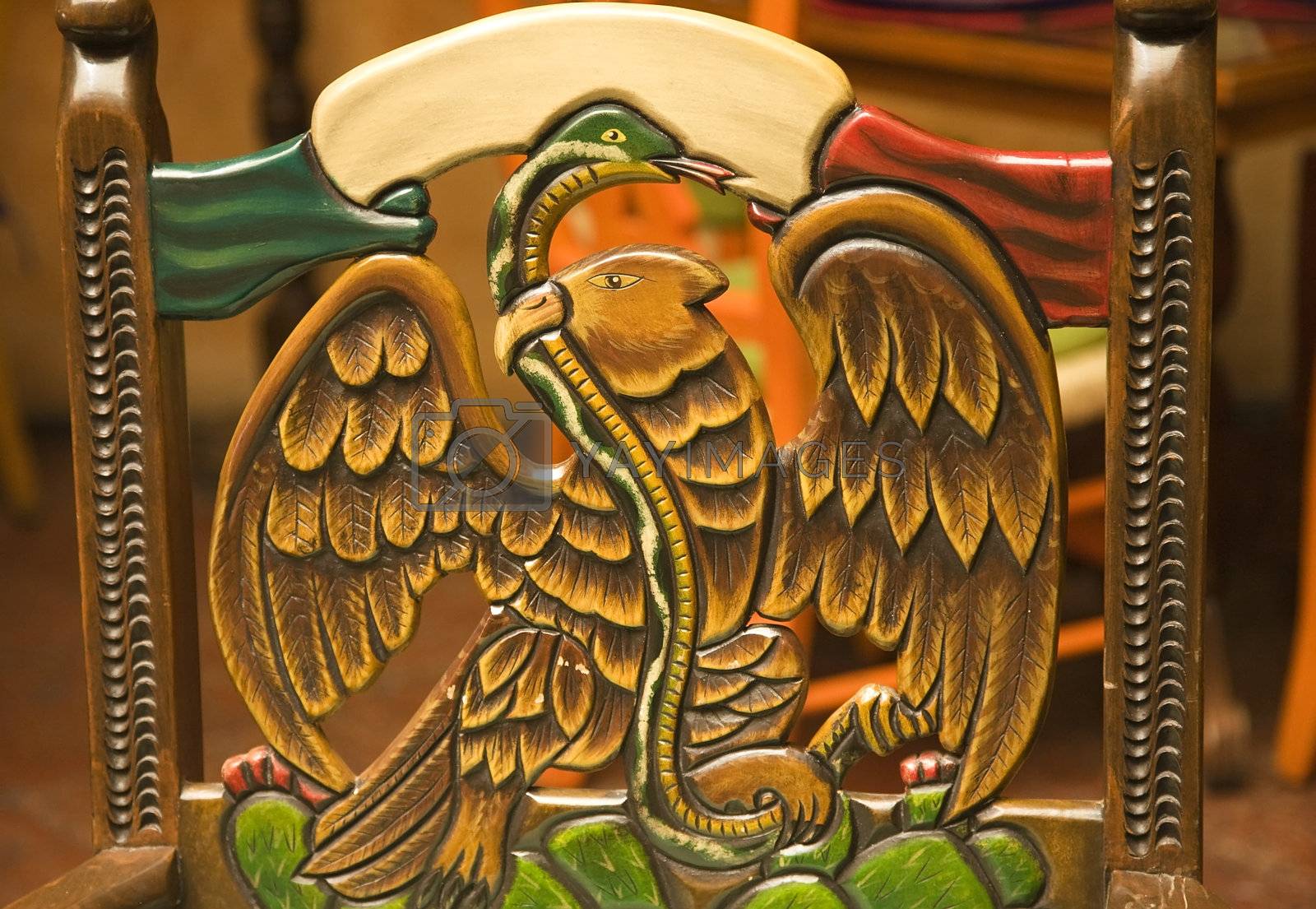 Royalty free image of Wooden Carved Chair Symbol of Mexico Eagle Holding Snake by bill_perry