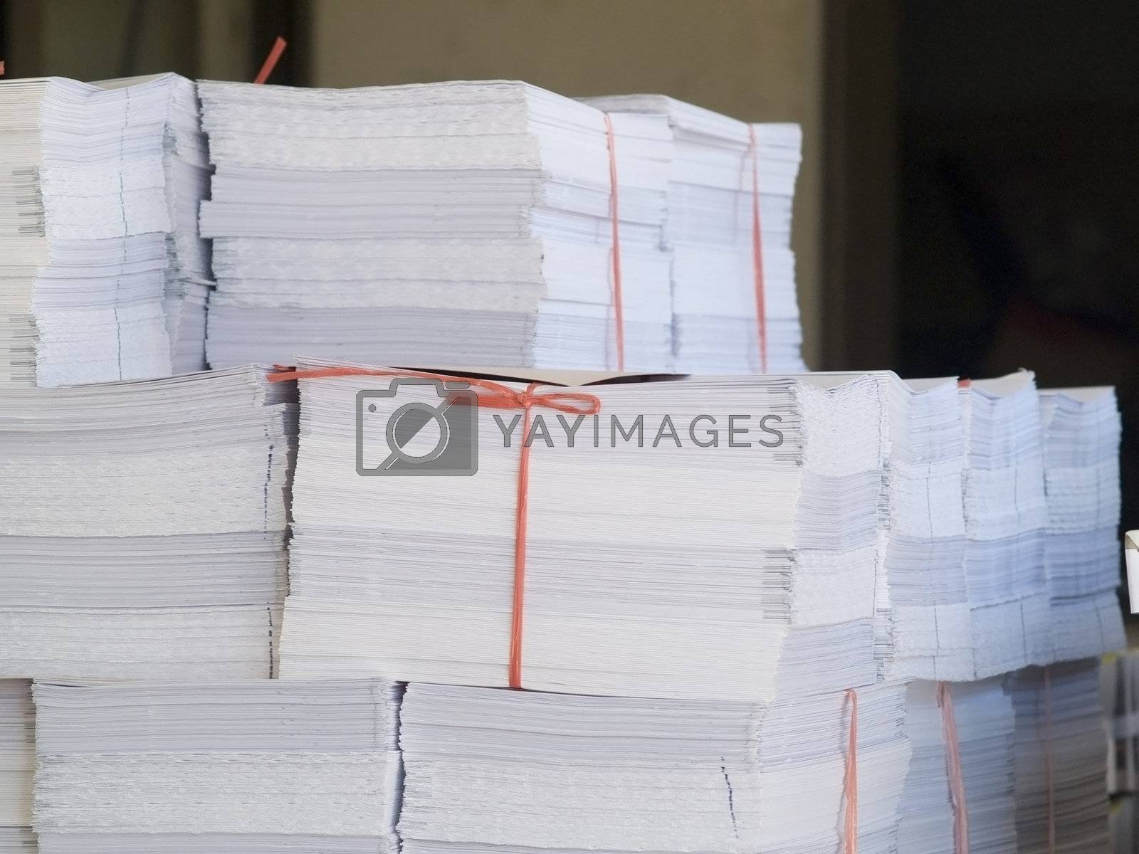 Royalty free image of Piles of printed paper by epixx