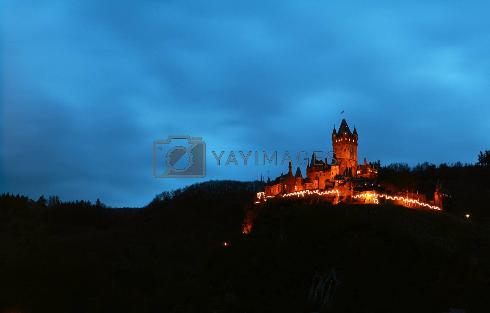 Royalty free image of castle at night by catolla