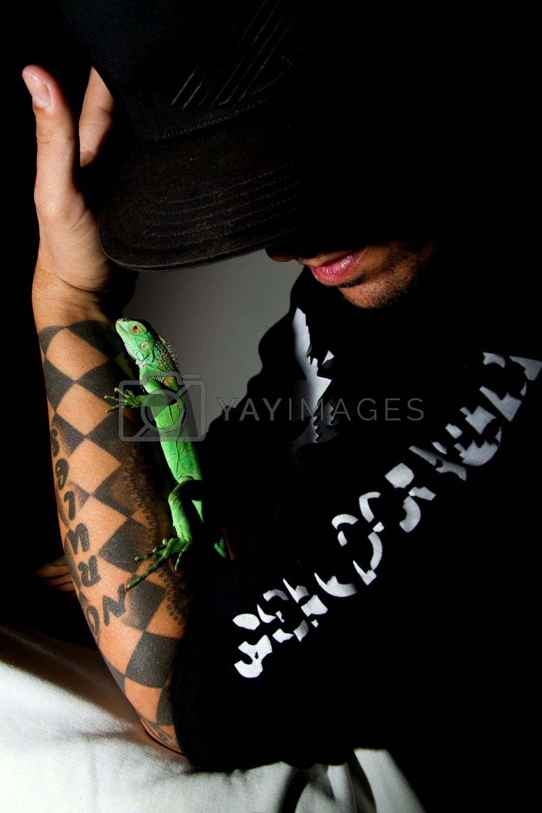 Royalty free image of man and iguana by membio
