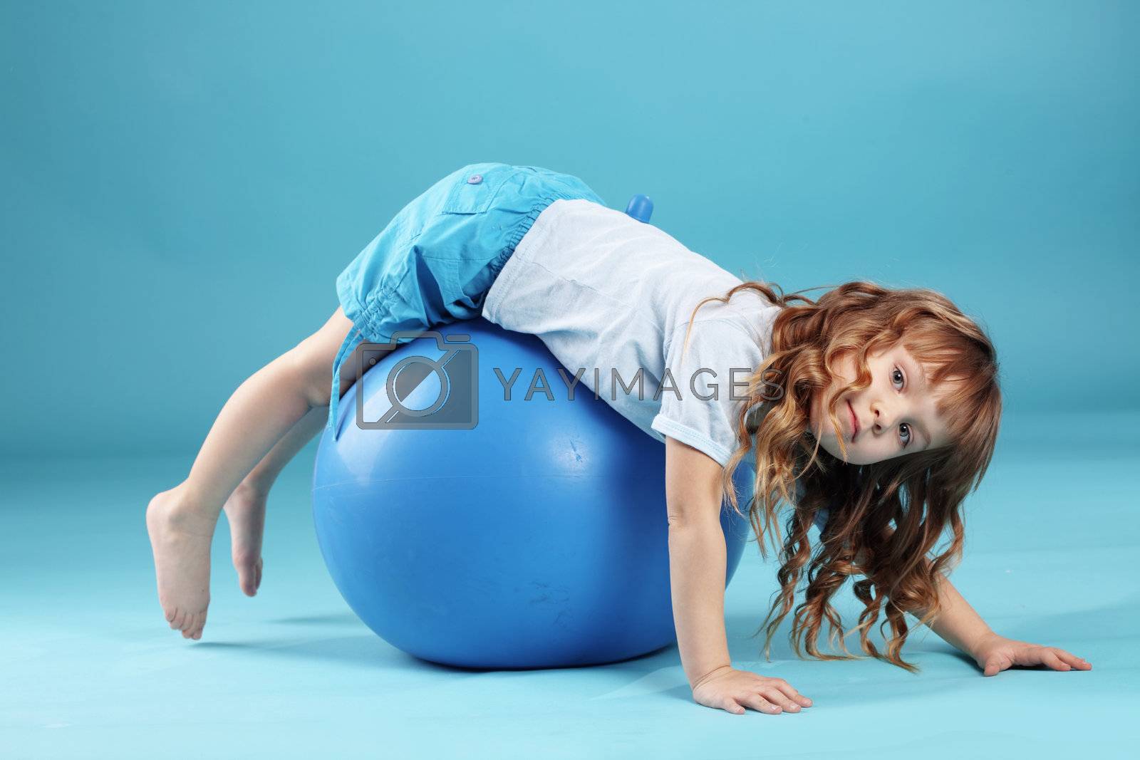 Royalty free image of Child with gymnastic ball by alenkasm