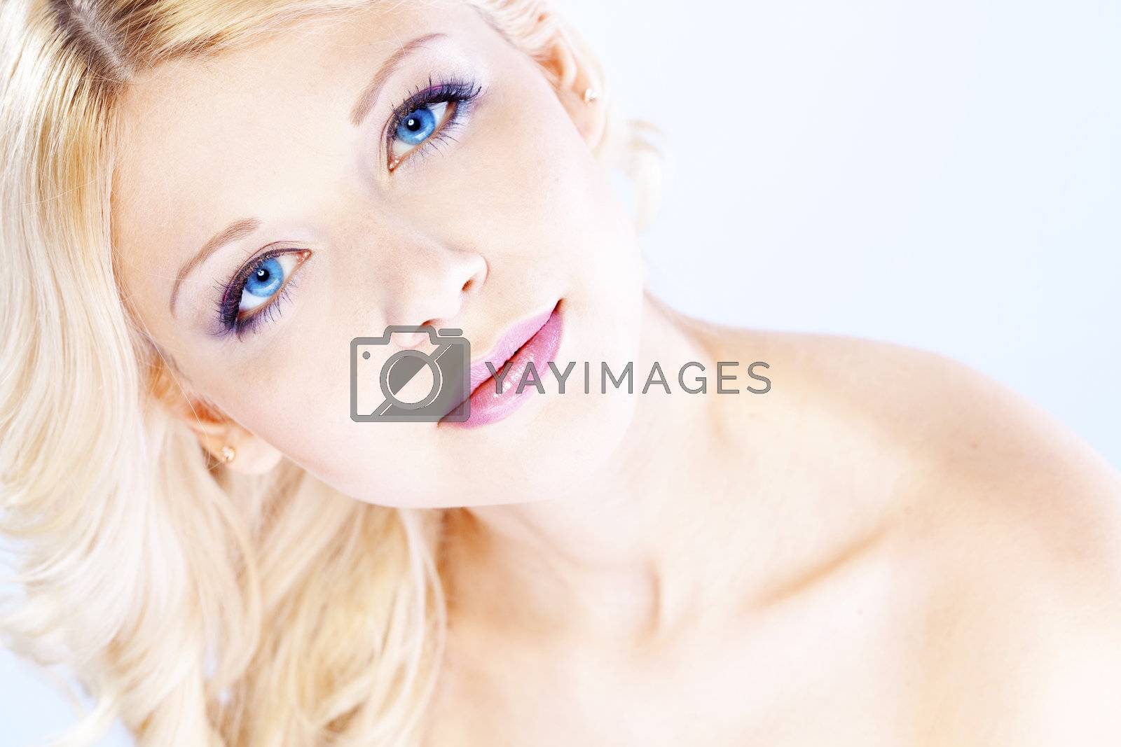 Portrait of young beautiful blond woman with fashion make-up and hairstyle