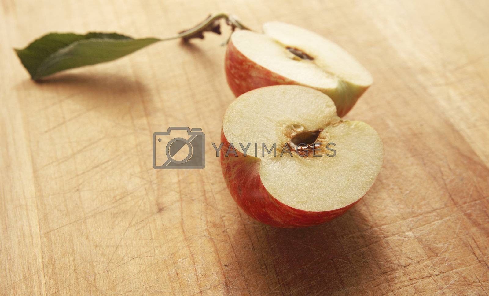 Royalty free image of apple cut in half by nebari