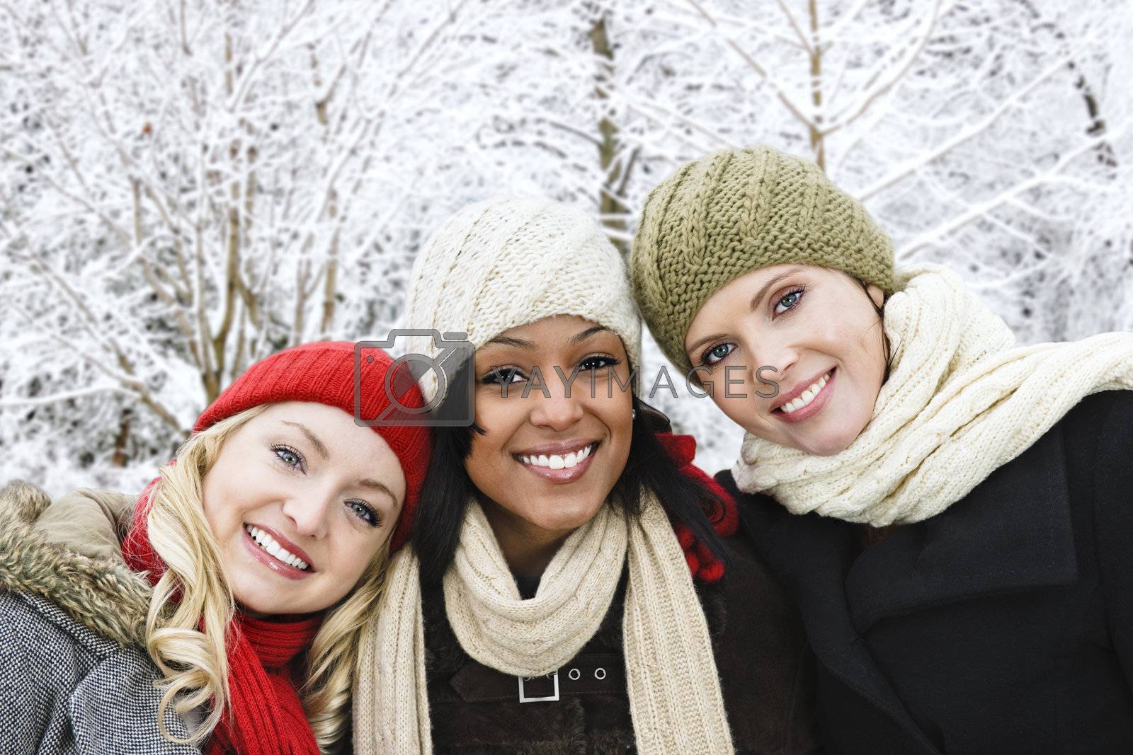 Royalty free image of Group of girl friends outside in winter by elenathewise