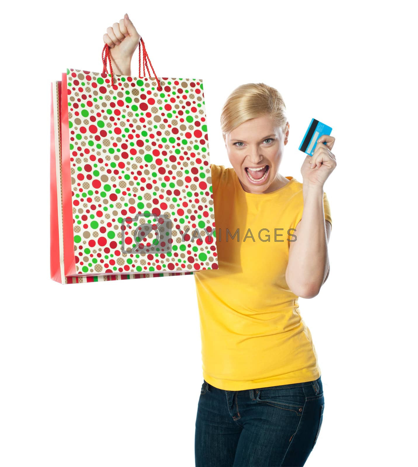 Royalty free image of Shopaholic teenager posing in excitement by stockyimages