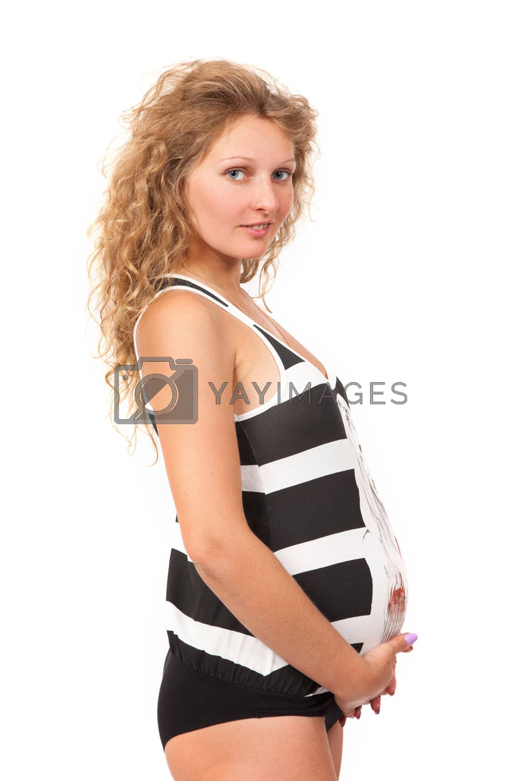 Royalty free image of Pregnant woman is caressing her belly by bloodua
