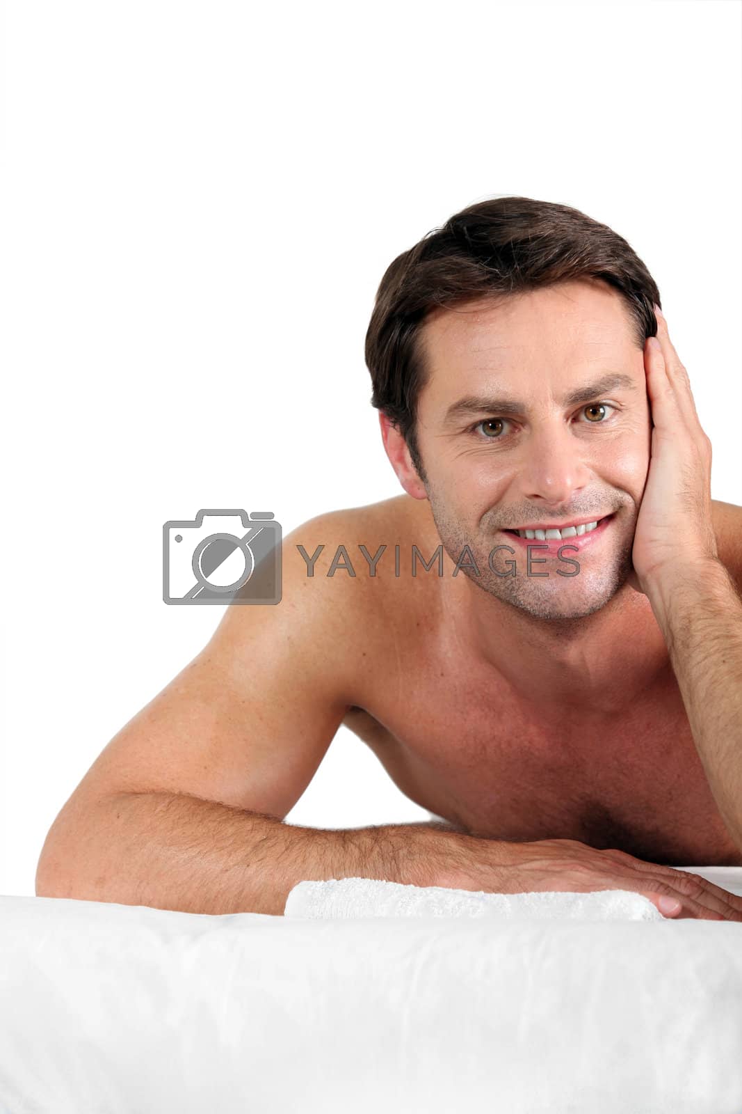 Royalty free image of Man laid on massage table by phovoir