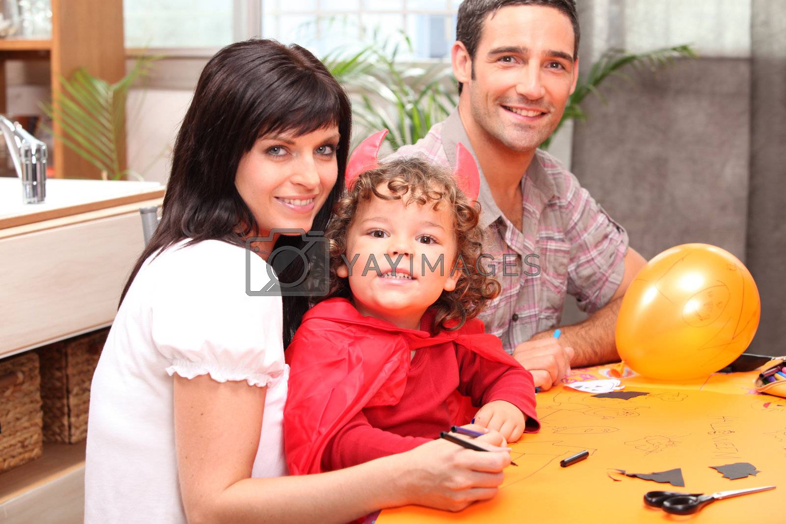 Royalty free image of A family making Halloween preparations. by phovoir