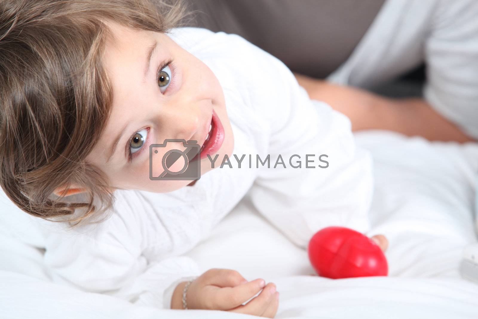 Royalty free image of Little girl laying on the sofa by phovoir
