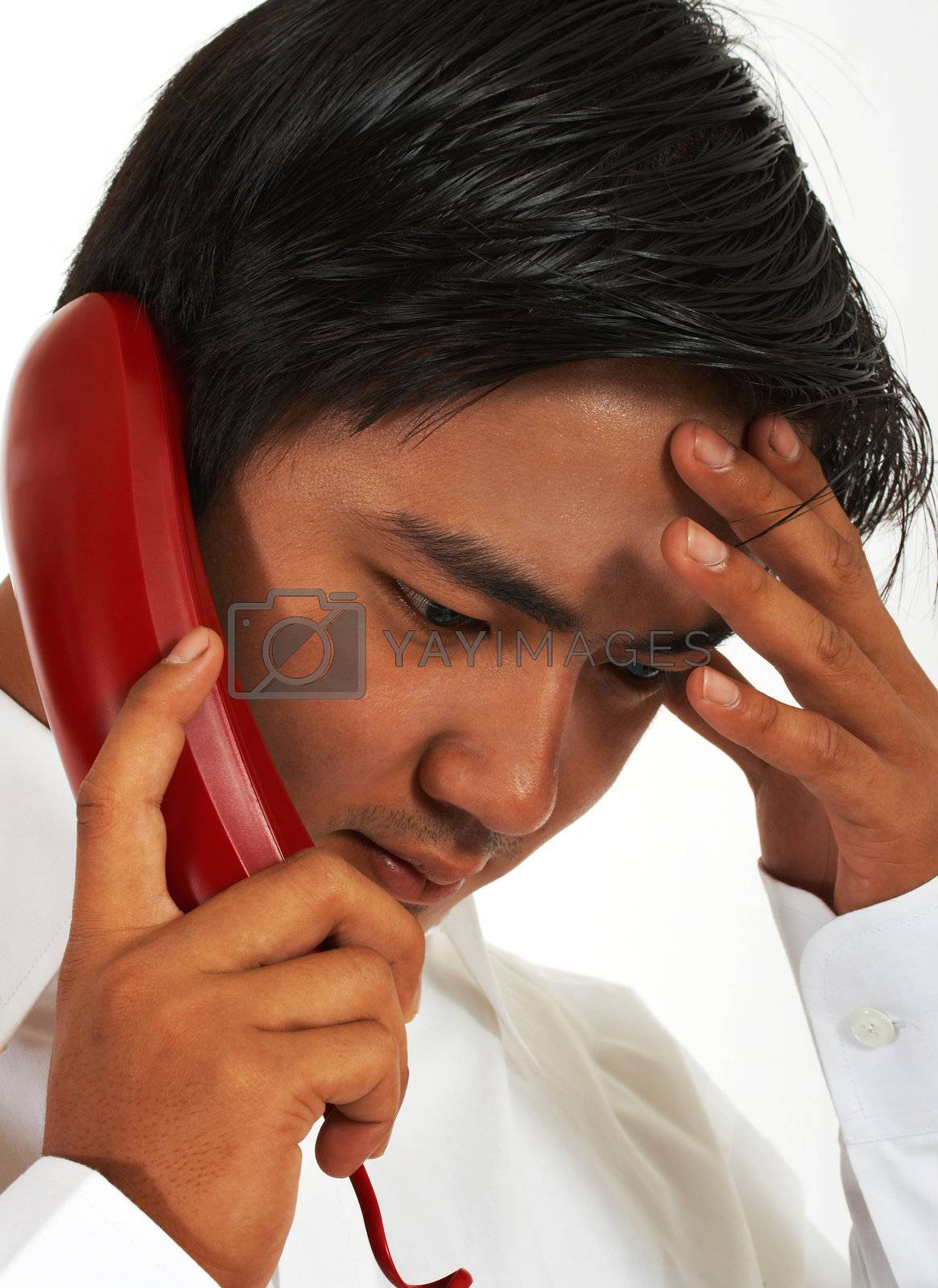 Busy Worker On The Telephone Looking Stressed And Serious