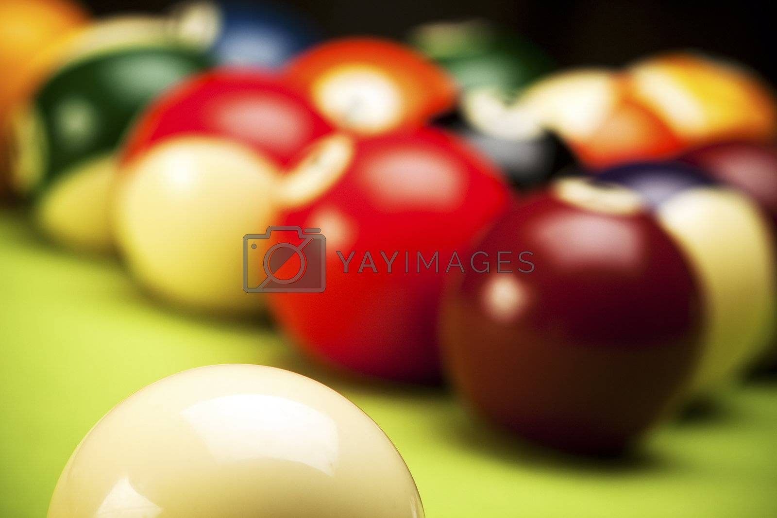 Royalty free image of Pool game on green table by fikmik