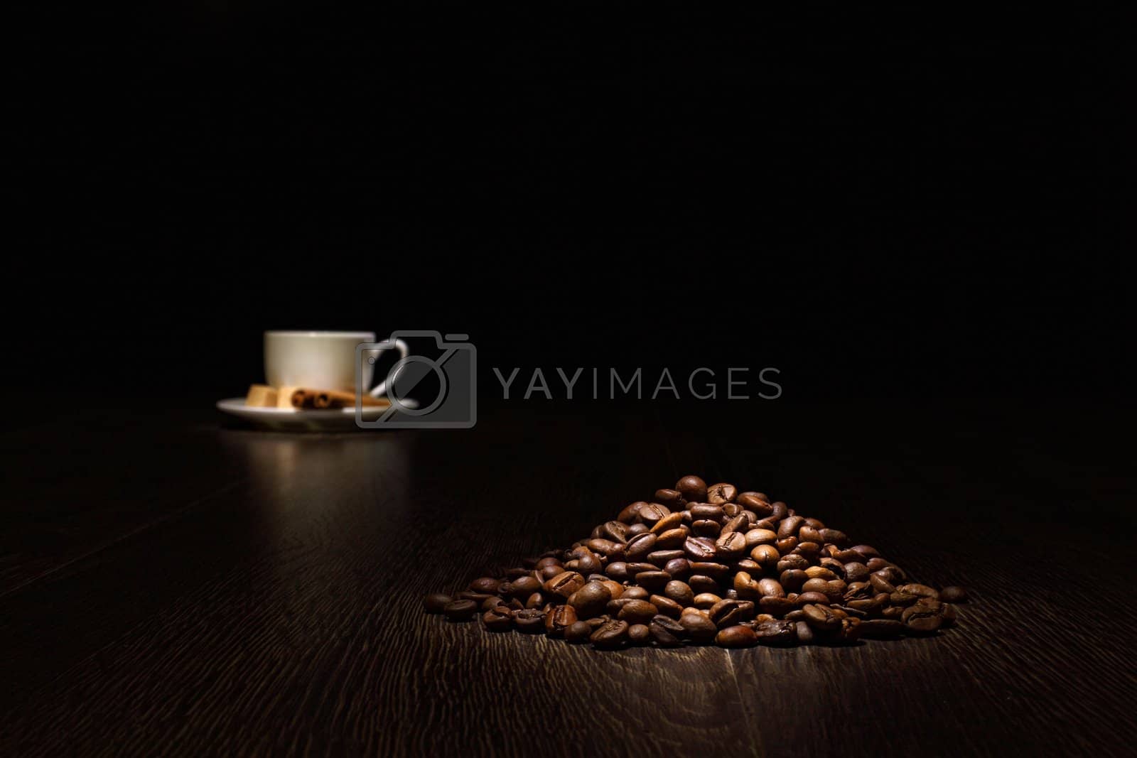 Royalty free image of Coffee beans and white cup by sergey_nivens