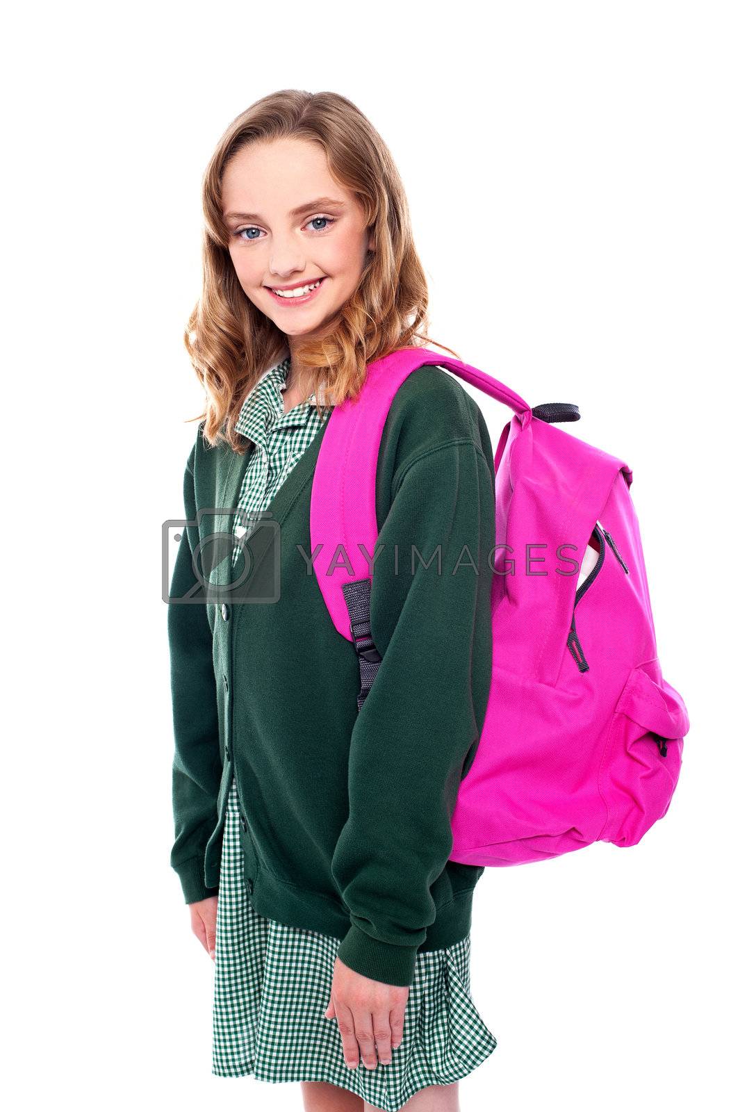 Royalty free image of School girl carrying bag on shoulders by stockyimages