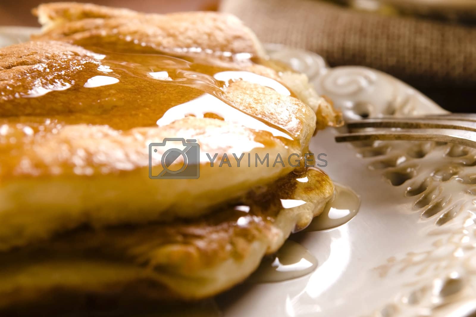 Royalty free image of Pancakes with syrup by joannawnuk