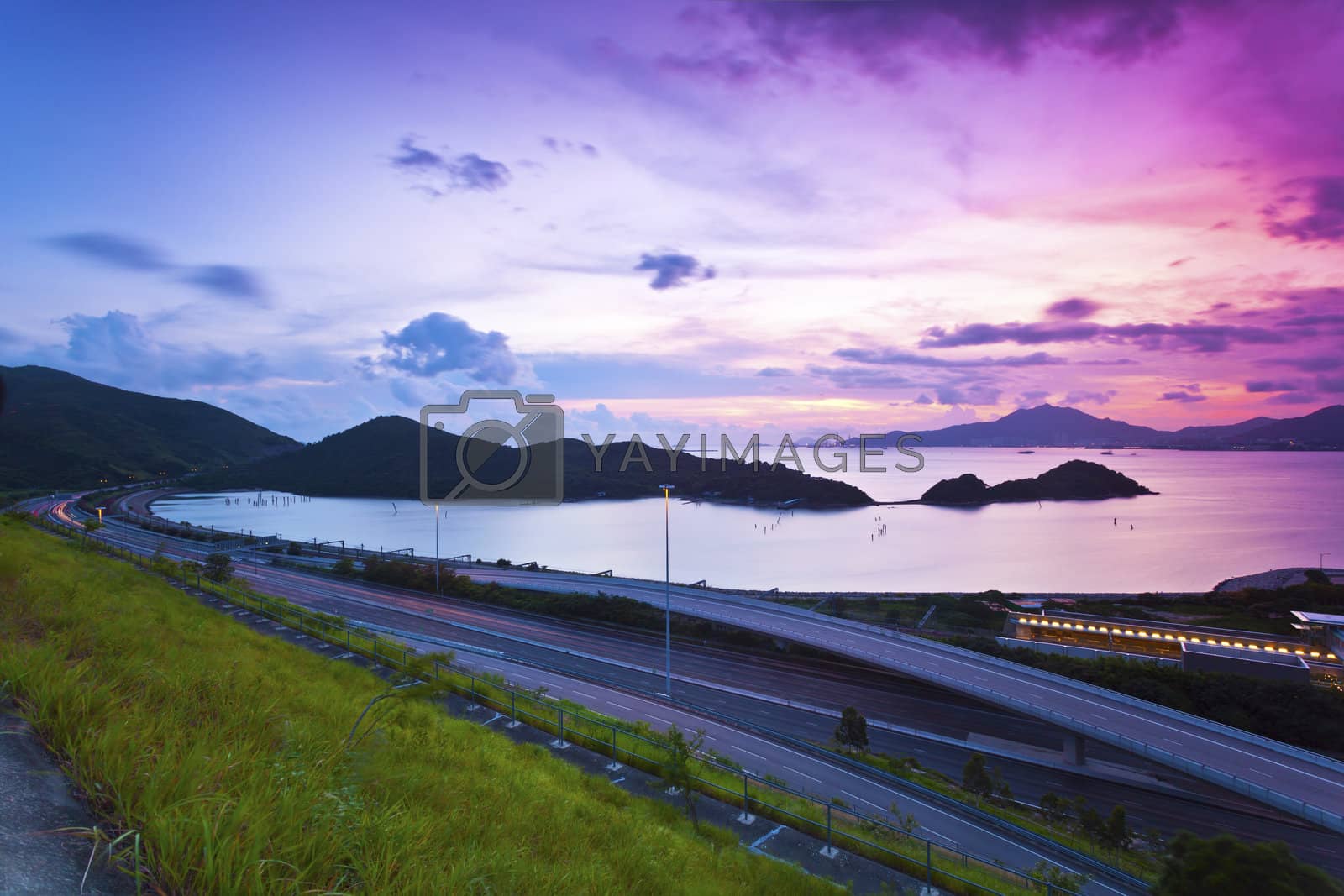 Royalty free image of Traffic highway in Hong Kong at sunset by kawing921