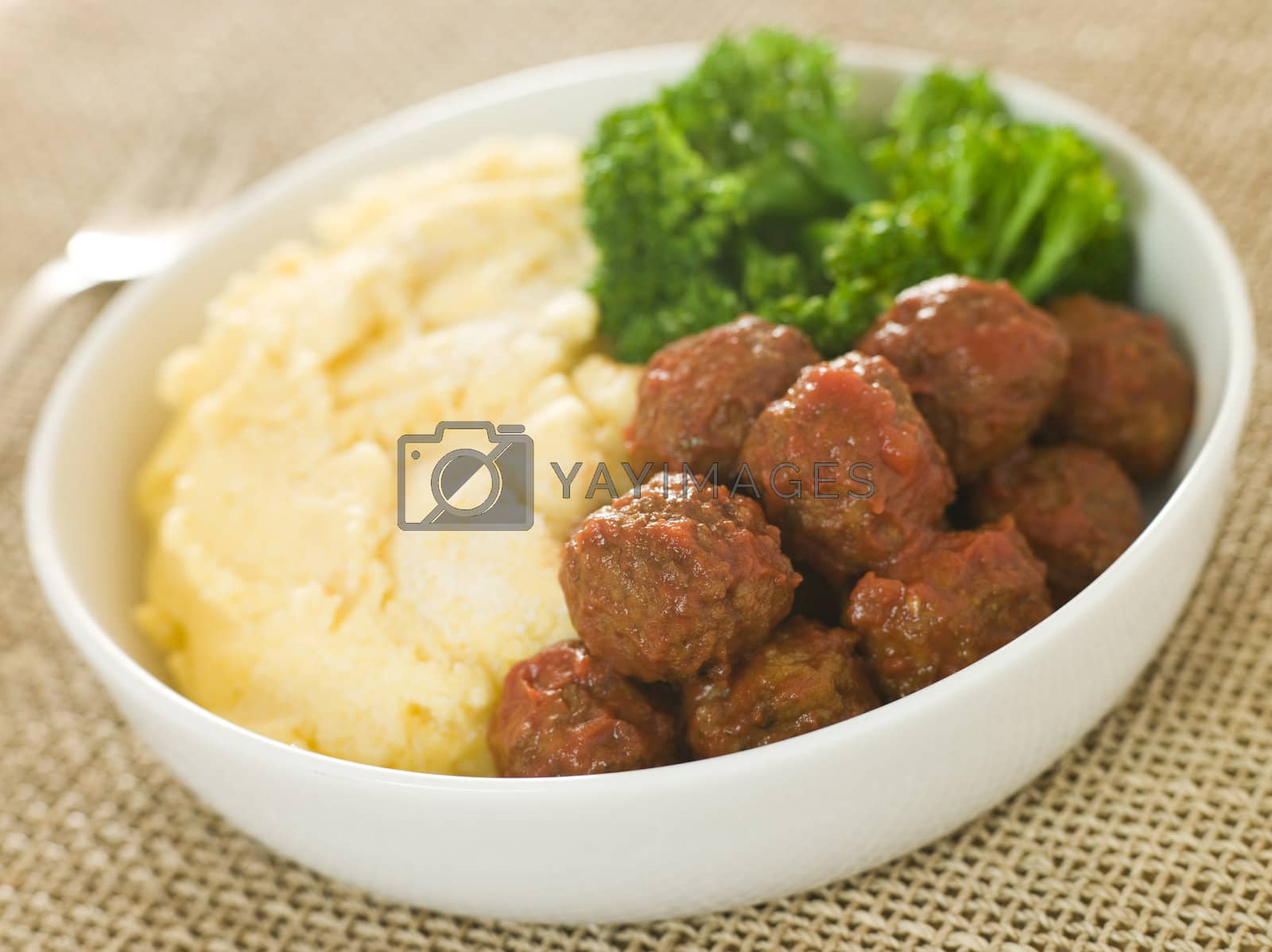 Royalty free image of Tomato Meatballs with Parmesan Polenta and Broccoli by MonkeyBusiness