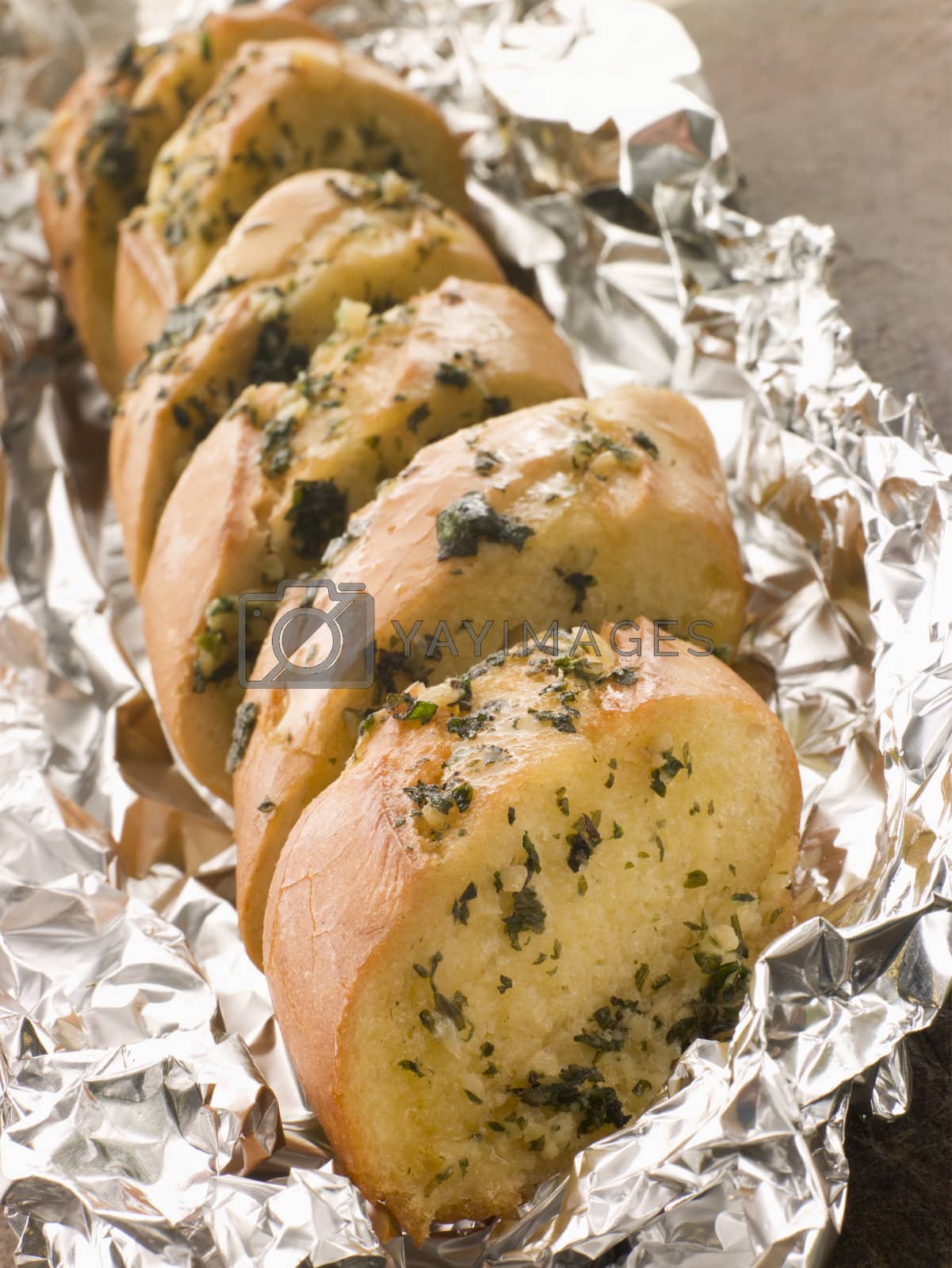 Royalty free image of Garlic Bread in Foil by MonkeyBusiness