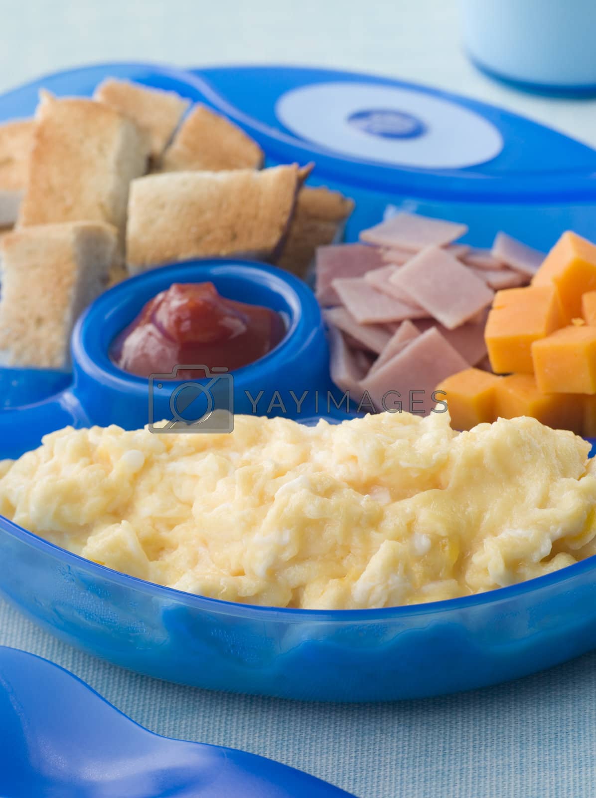 Royalty free image of Scrambled Egg with Toast Ham and Cheese Squares by MonkeyBusiness