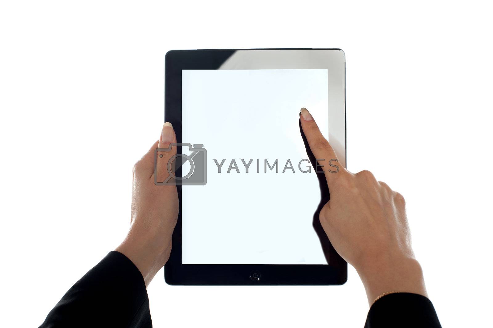 Royalty free image of Closeup shot of female finger operating tablet by stockyimages