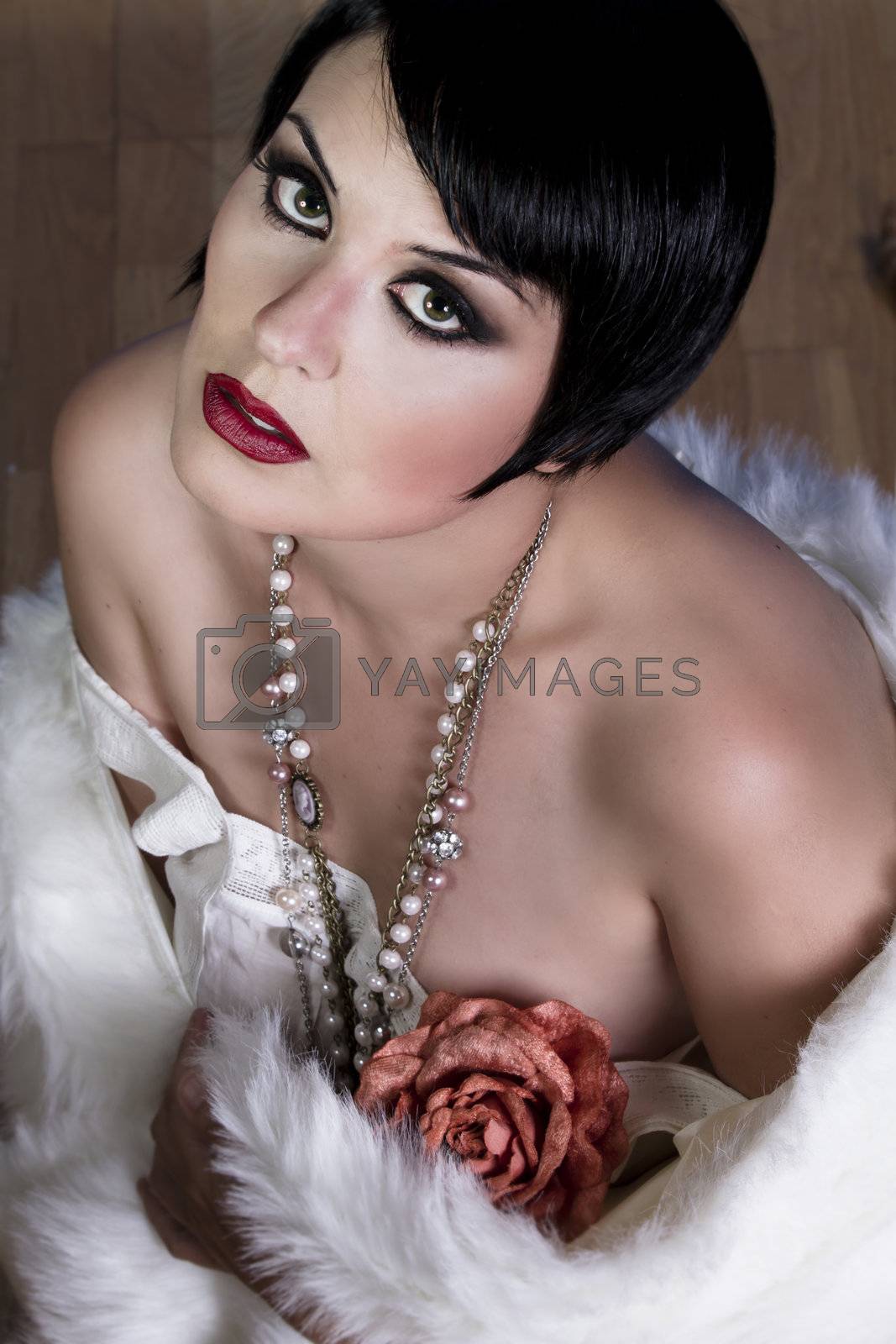 Royalty free image of 20s style beautiful brunette female wearing fur, exquisite by FernandoCortes