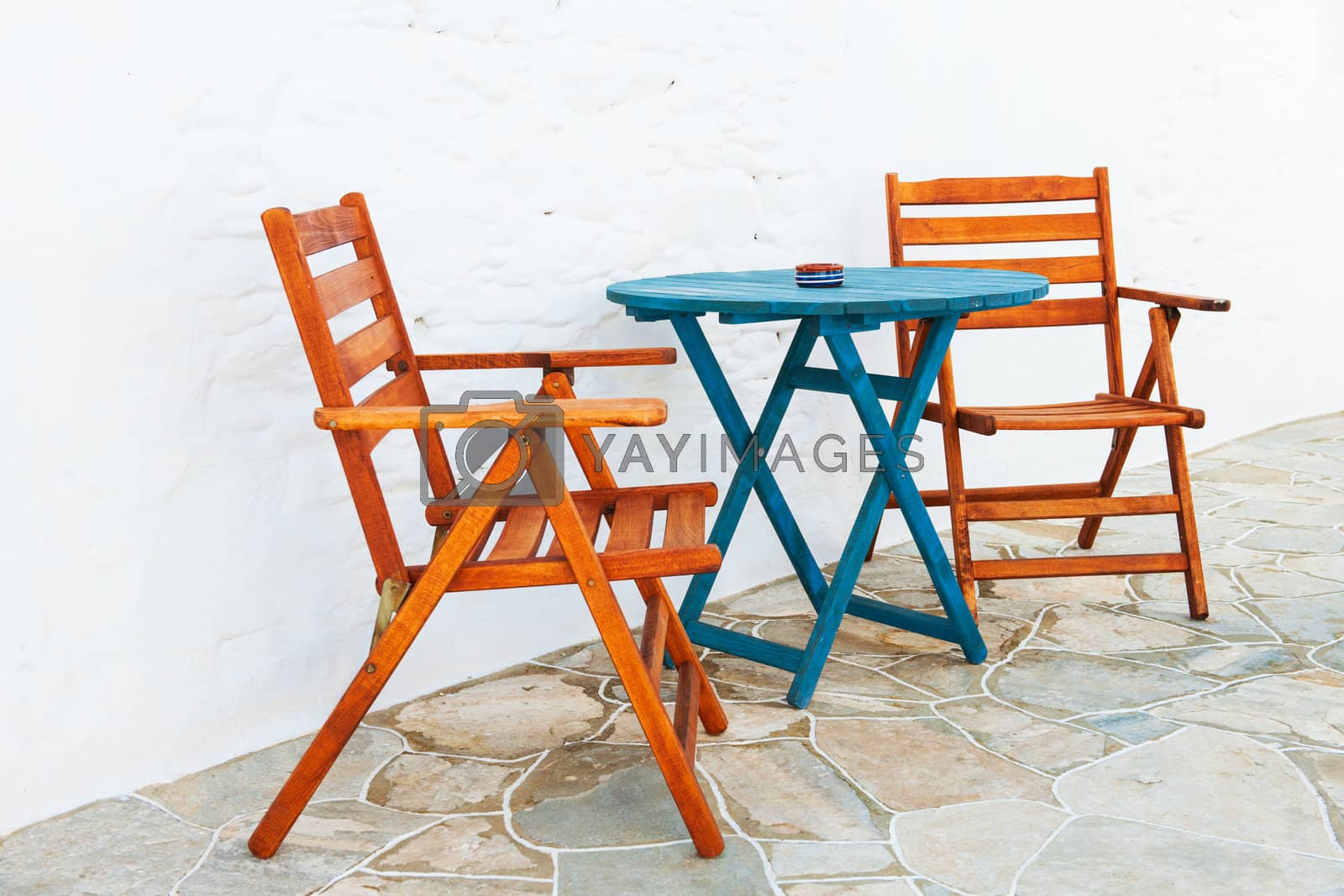 Royalty free image of Colorful table and chairs arrangement by akarelias