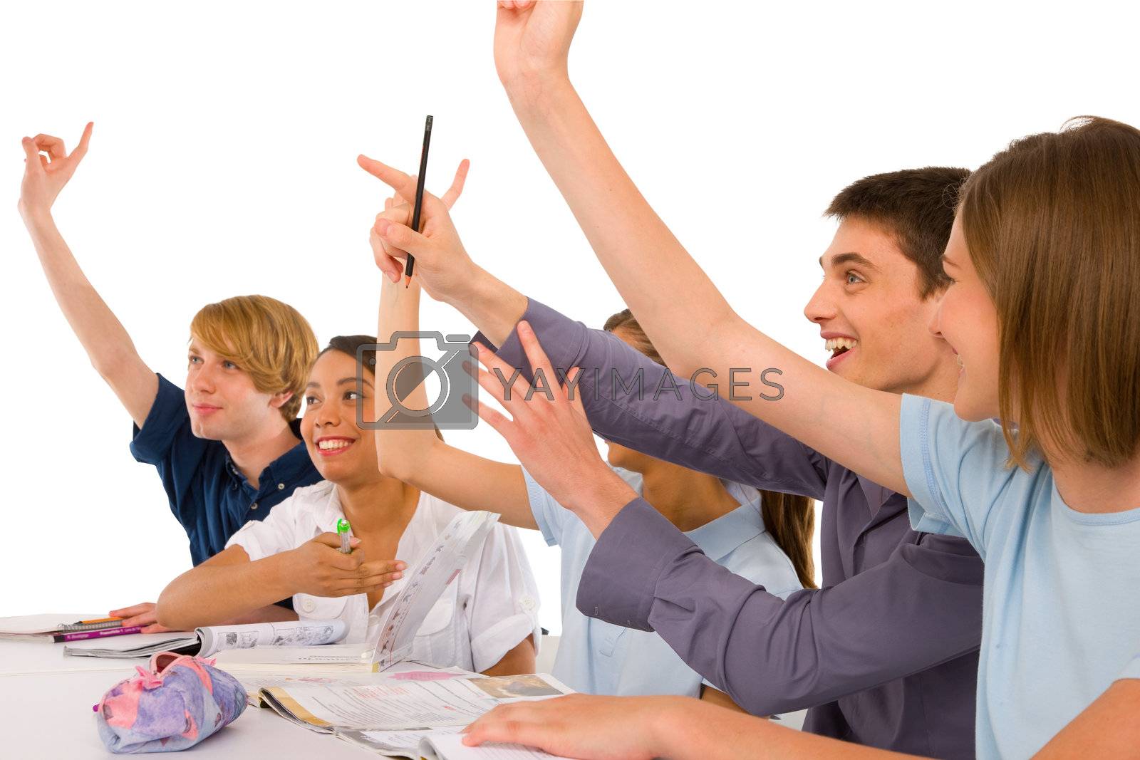 Royalty free image of teenagers in classroom with arms up by ambro