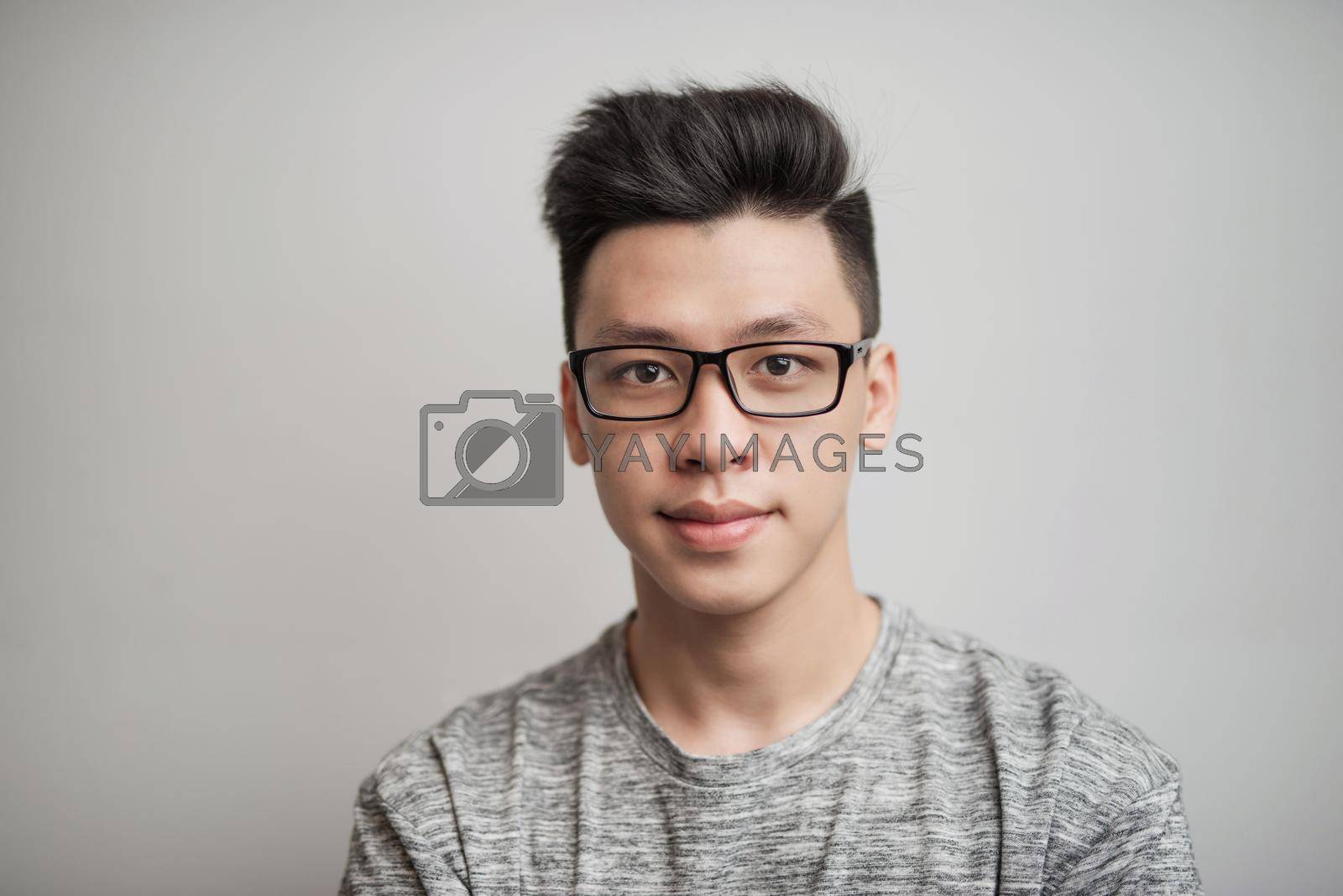 Royalty free image of Portrait of good looking asian man in glasses by makidotvn