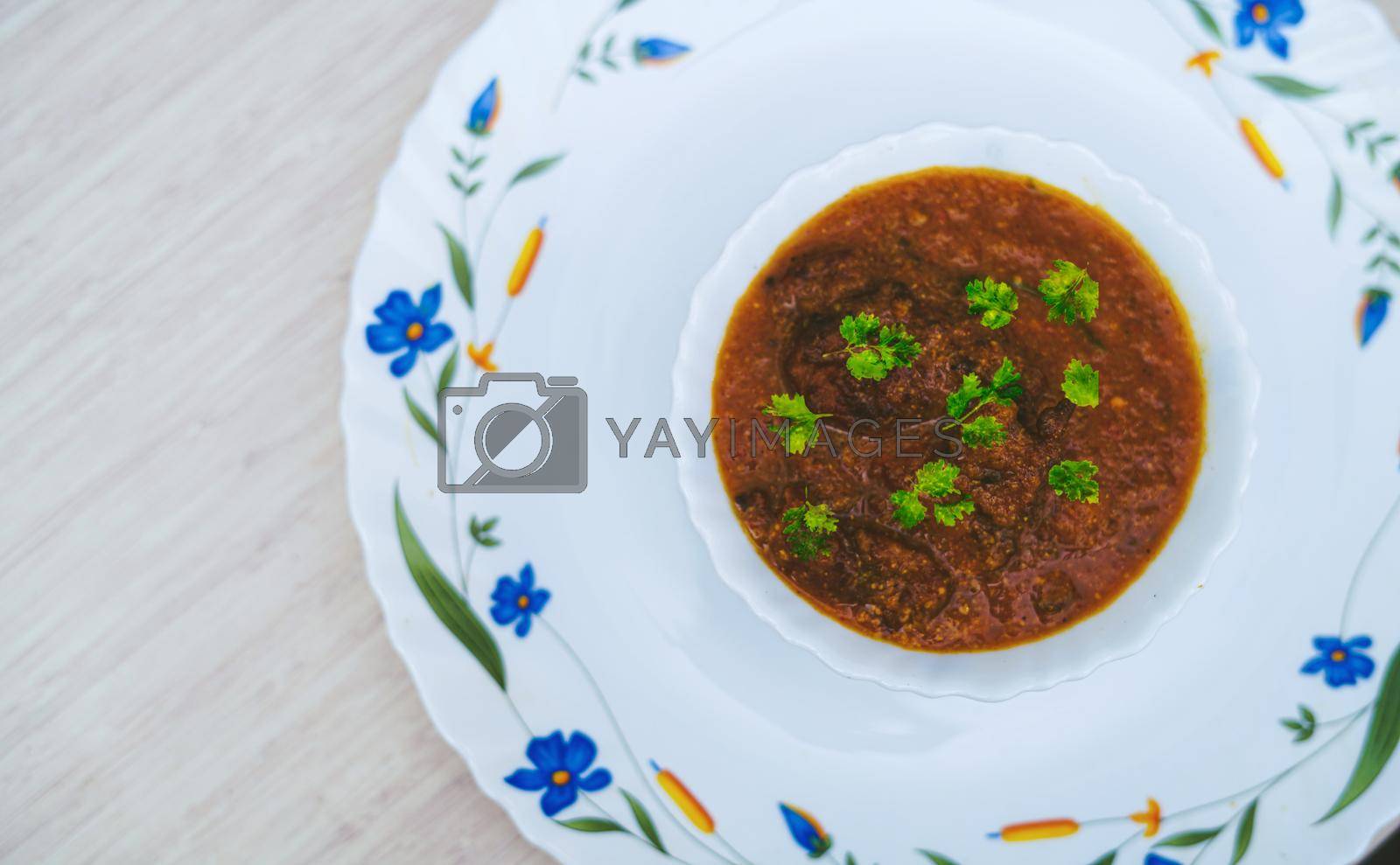 Royalty free image of Lauki ke Kofte, light tomato based delicious gravy dunked with koftas made from bottle gourd by yogendras31