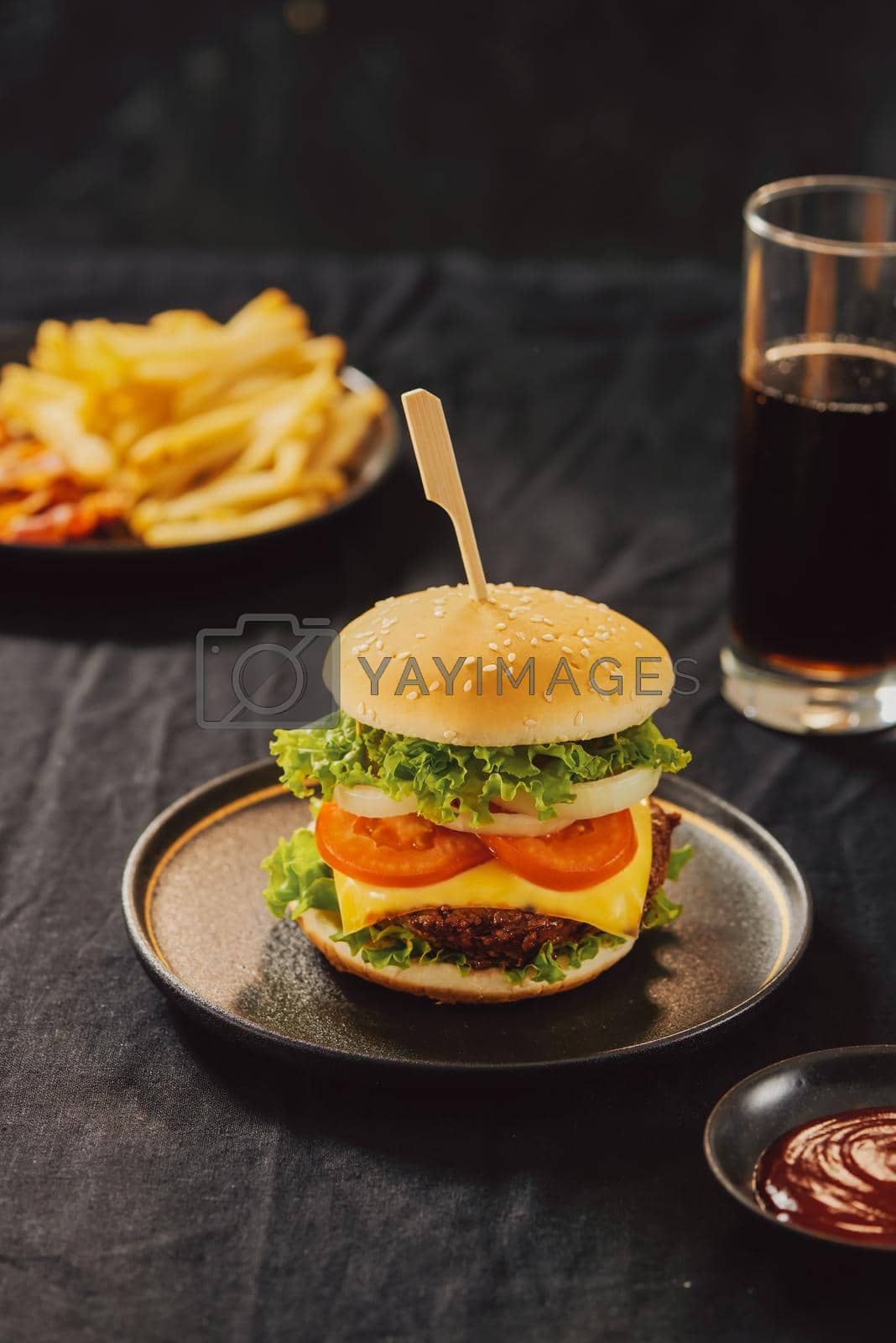 Royalty free image of Unhealthy concept. unhealthy food: Burger, sauce, potatoes, cola.  by makidotvn