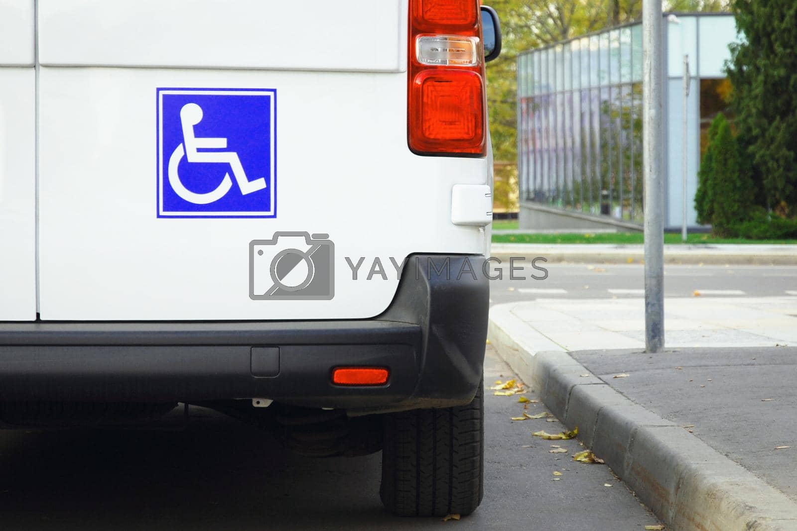 Disability sign on minivan back door, public transport accessibility