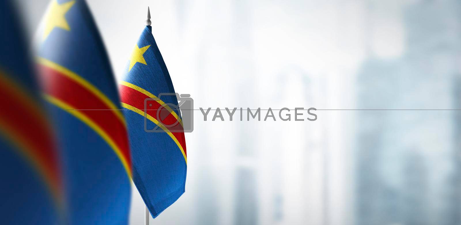 Royalty free image of Small flags of Democratic Republic of the Congo on a blurry background of the city by butenkow