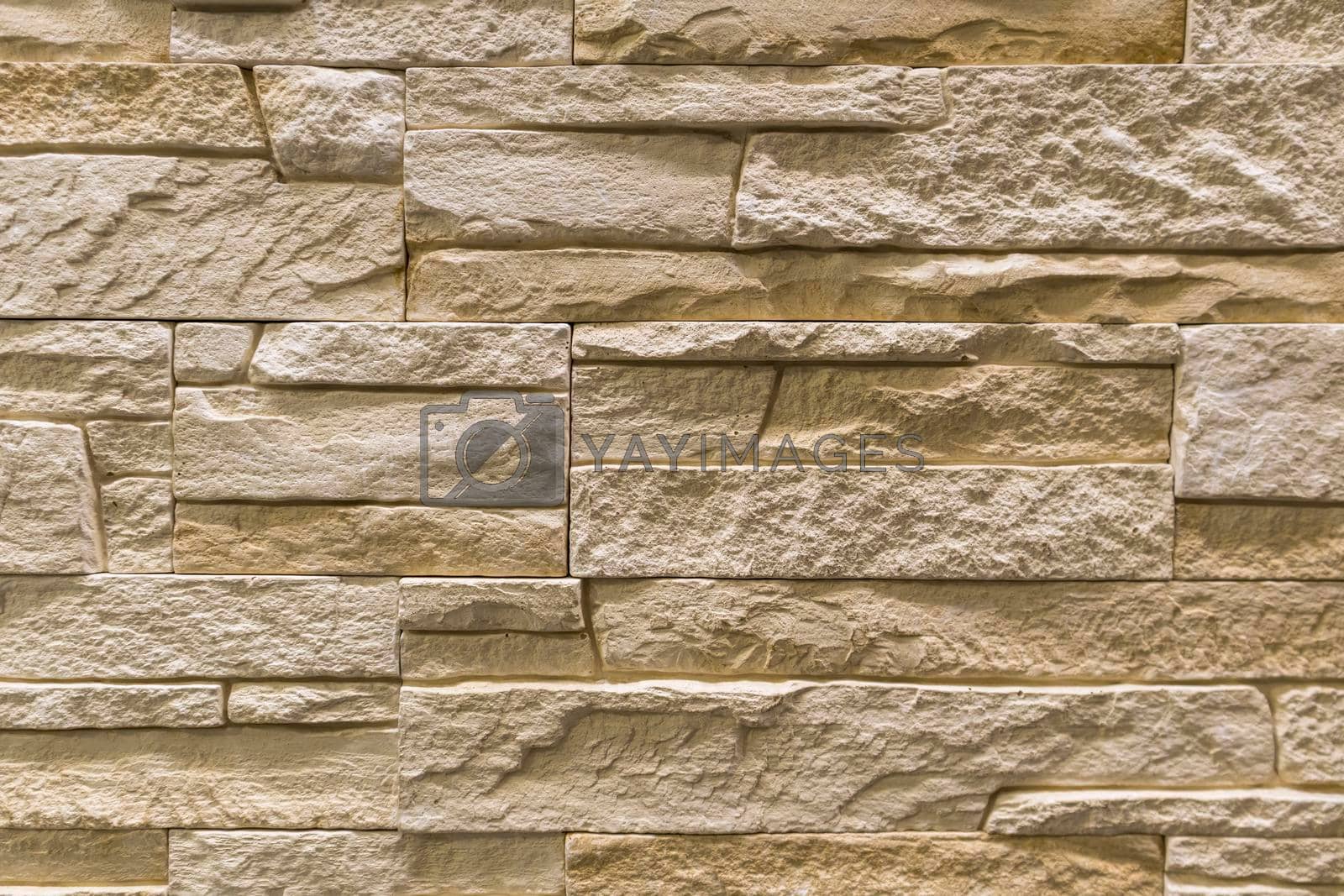 Royalty free image of masonry wall paving stones as a background close up by roman112007