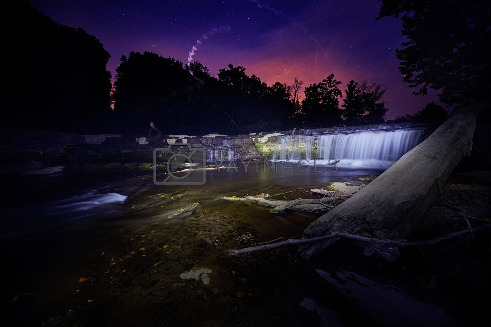 Royalty free image of Ghostly lights in a purple dusk with waterfalls at Cataract Falls by njproductions