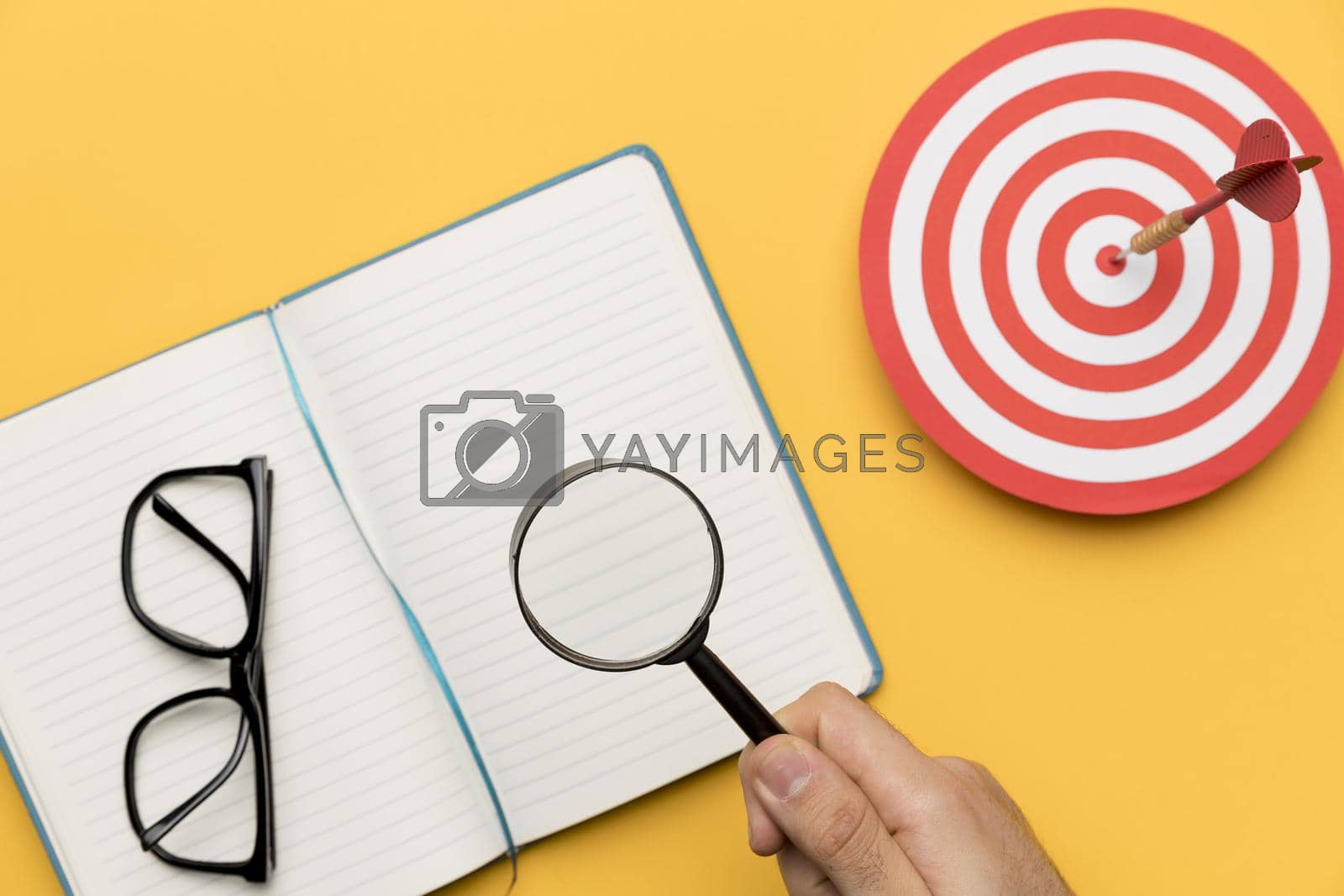 Royalty free image of agenda with dartboard magnifier. High quality beautiful photo concept by Zahard