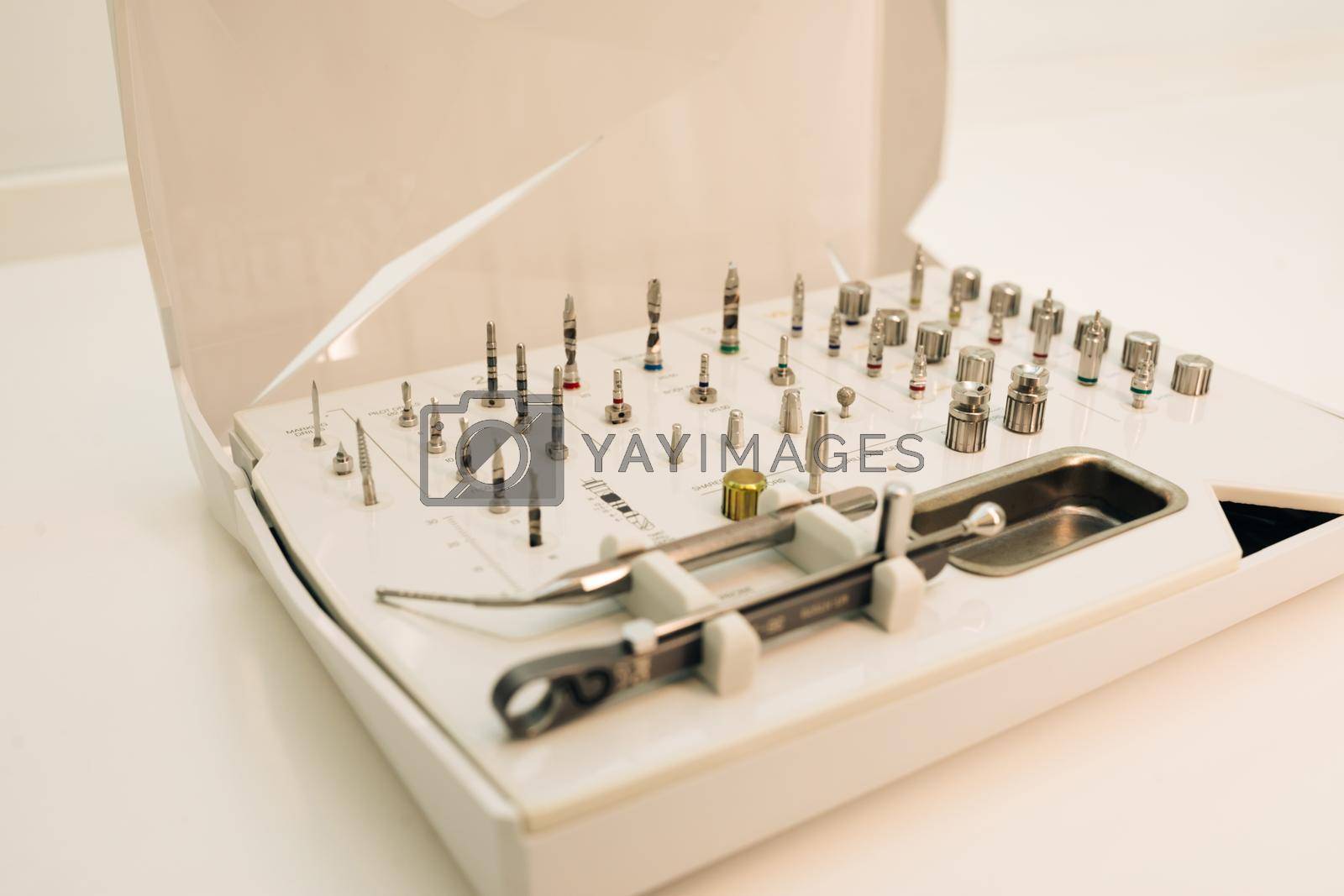 Surgical kit of instruments used in dental implantology. Dentistry. Dental implantation surgical set. Dentist orthopedist tools.