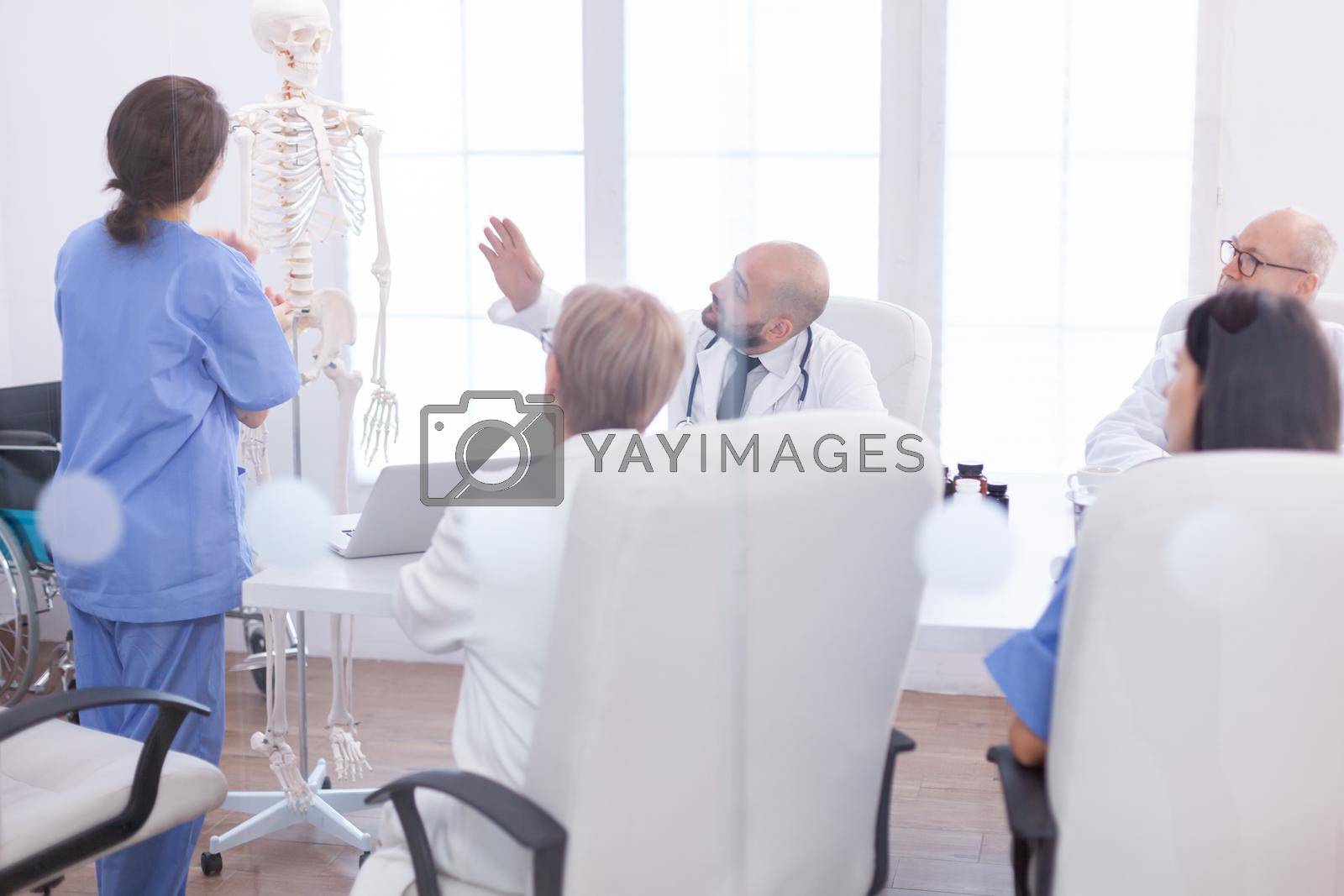 Royalty free image of Expert doctor in radiology pointing by DCStudio