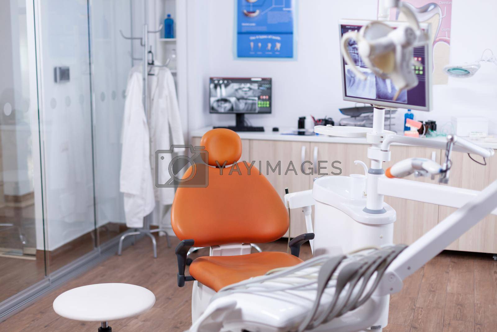 View at equipment in the modern dentist office. Stomatology equipment in dental private hospital with nobody in it. Different dental instruments and tools.