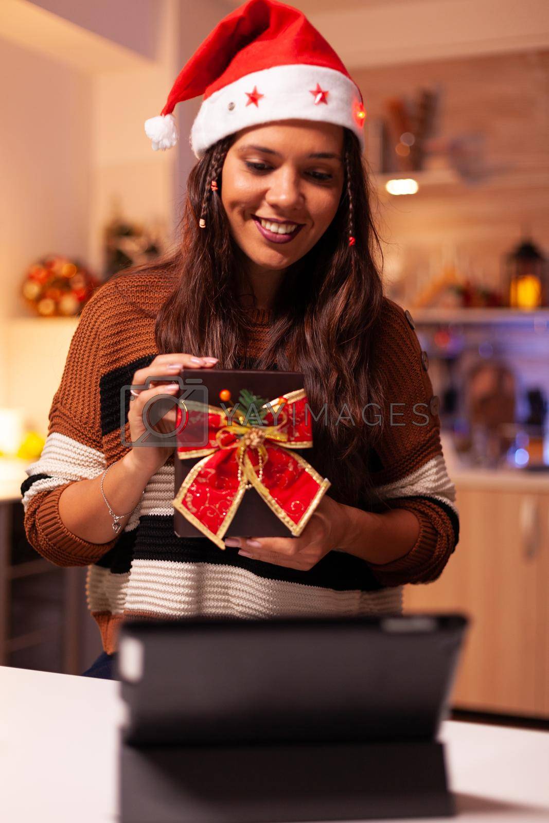 Royalty free image of Young person using video call technology on tablet by DCStudio