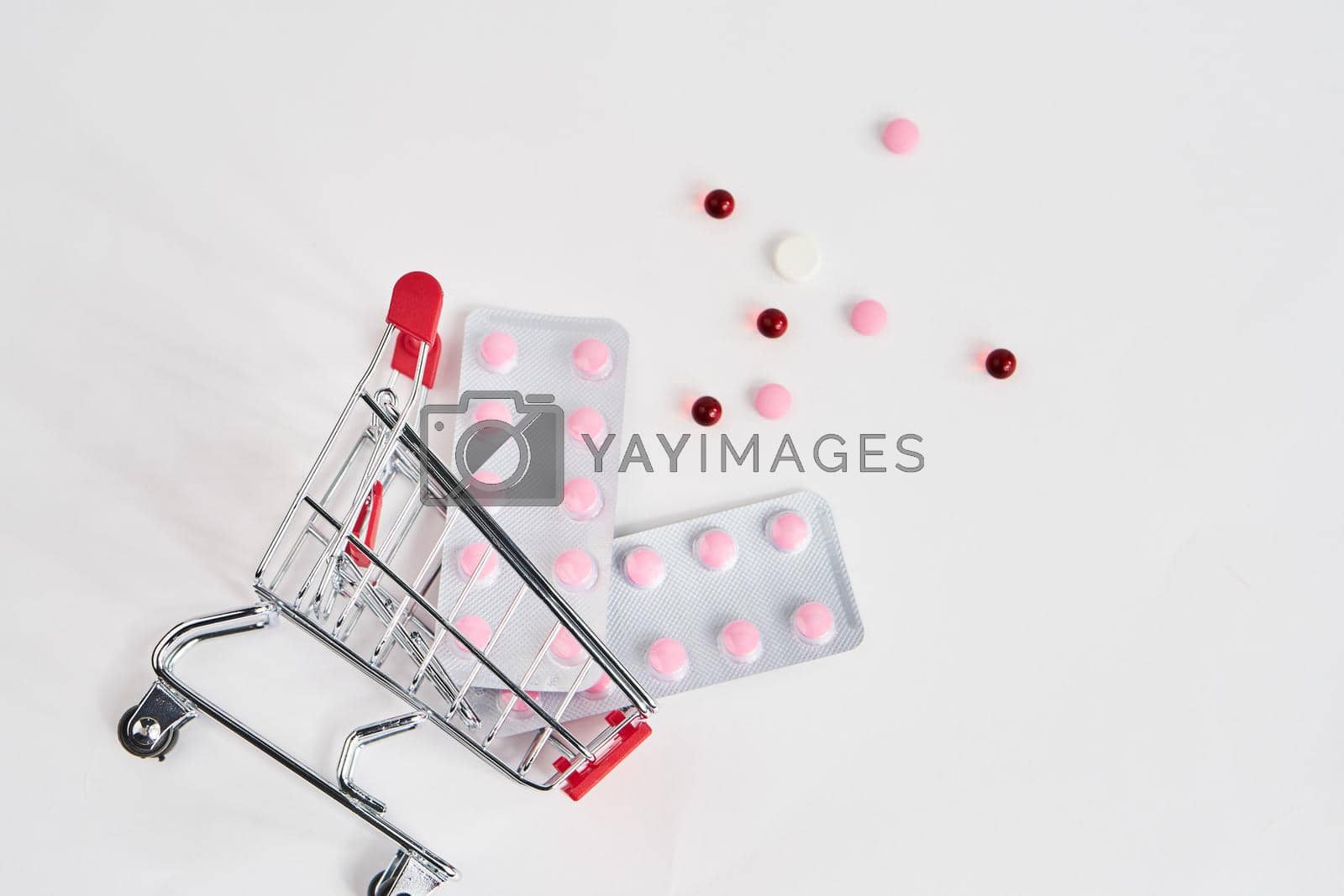 Royalty free image of drug trolleys pharmacy shopping light background pharmacy by Vichizh