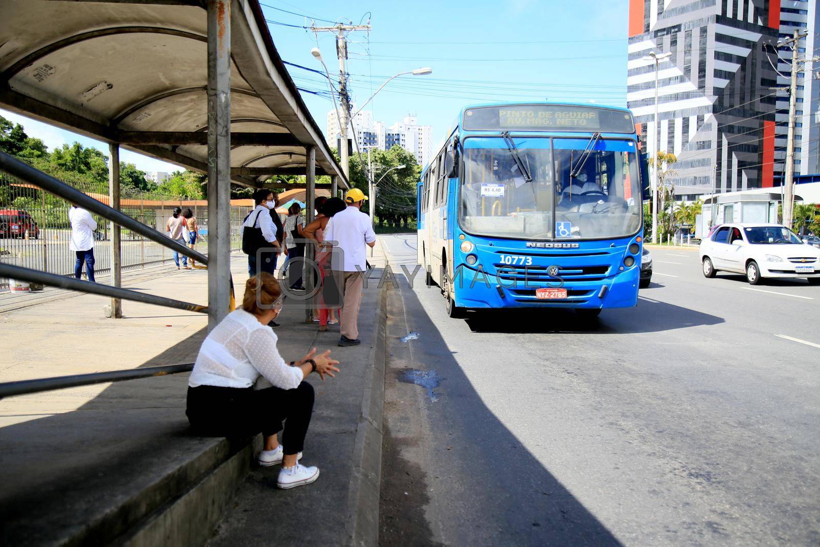 salvador, bahia, brazil - july 20, 2021: passengers are seen waiting for public transport buses at a bus stop in the city of Salvador.