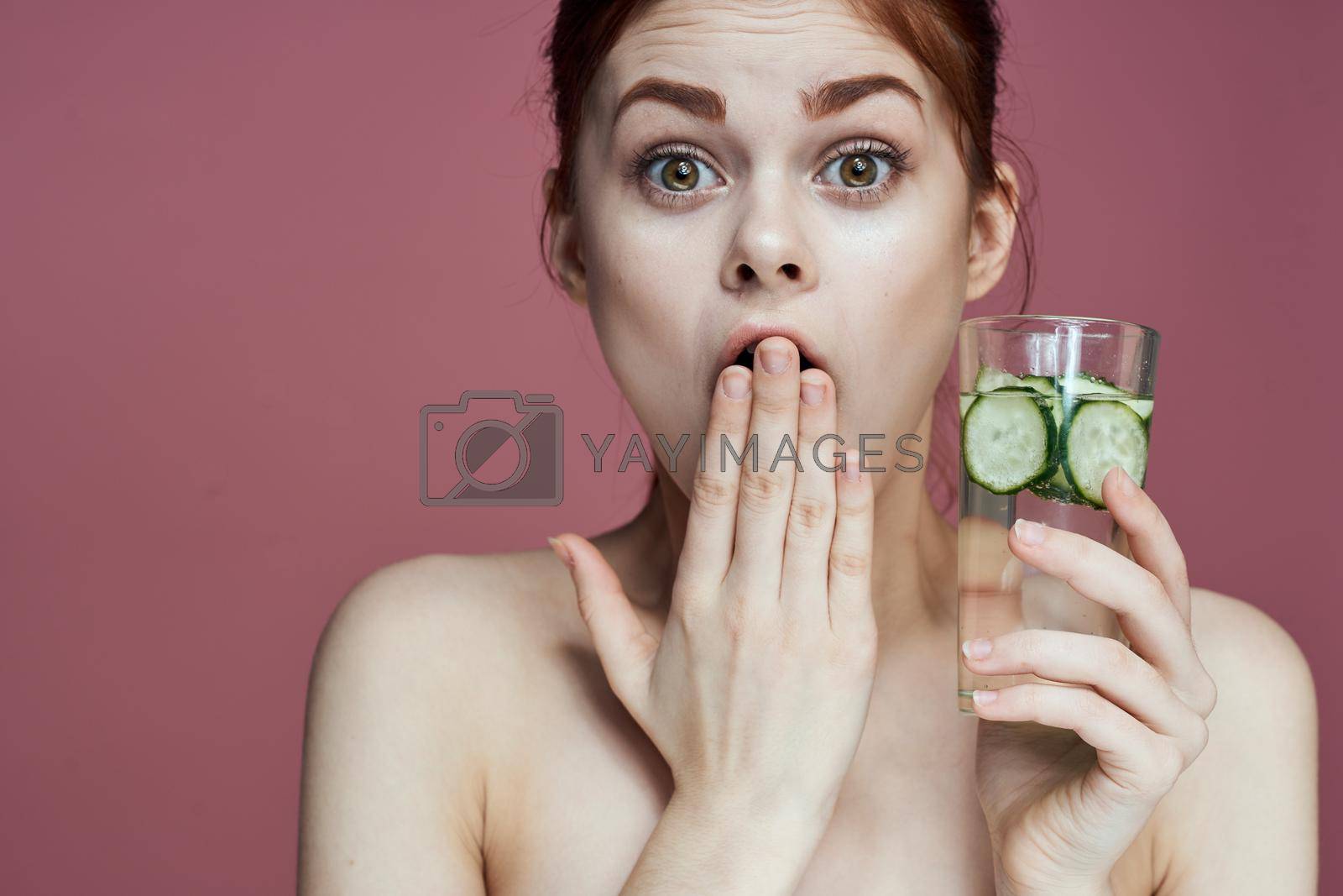 pretty woman with cucumber drink vitamins health beauty. High quality photo