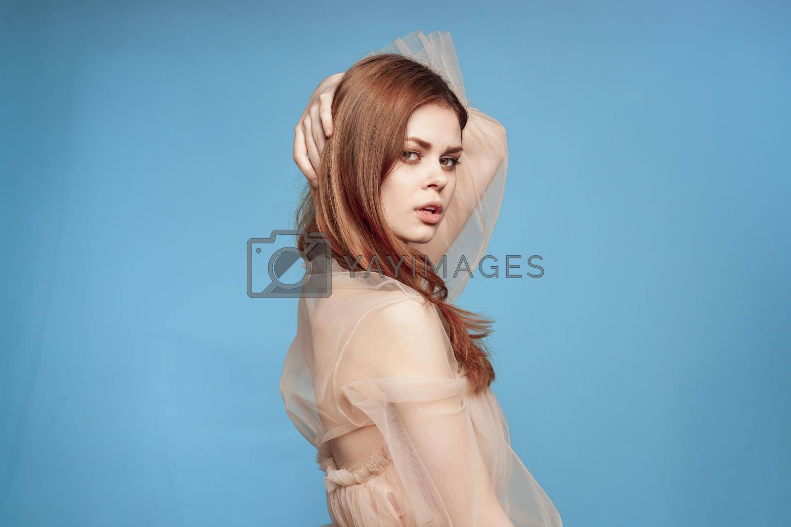 cheerful woman attractive look lifestyle romance blue background. High quality photo