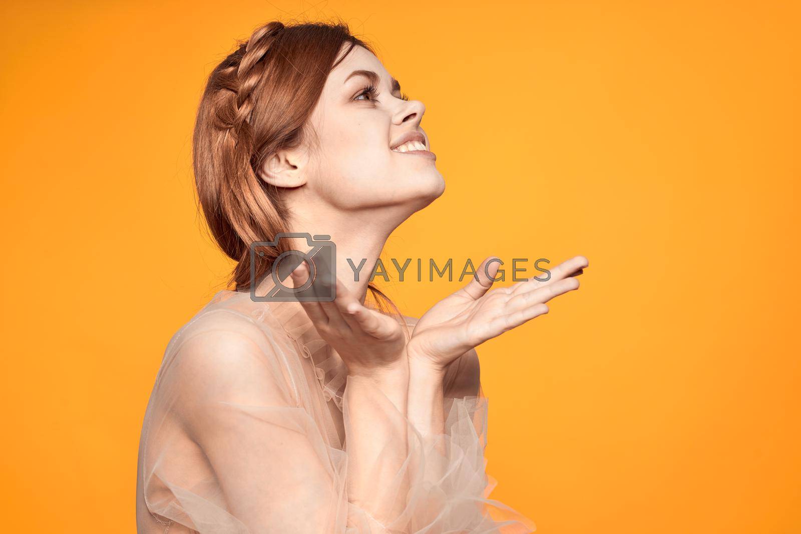 cheerful woman attractive look lifestyle romance yellow background. High quality photo