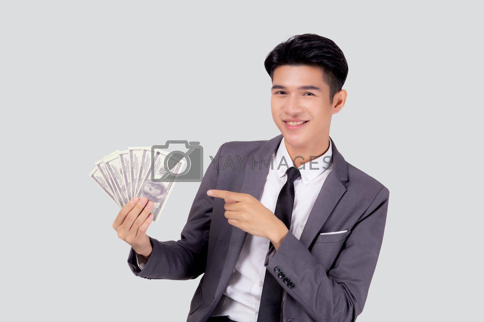 Royalty free image of Young asian business man holding money dollar isolated on white background, businessman in suit holding banknote and success and excited with finance, savings and investment, income and spending. by nnudoo