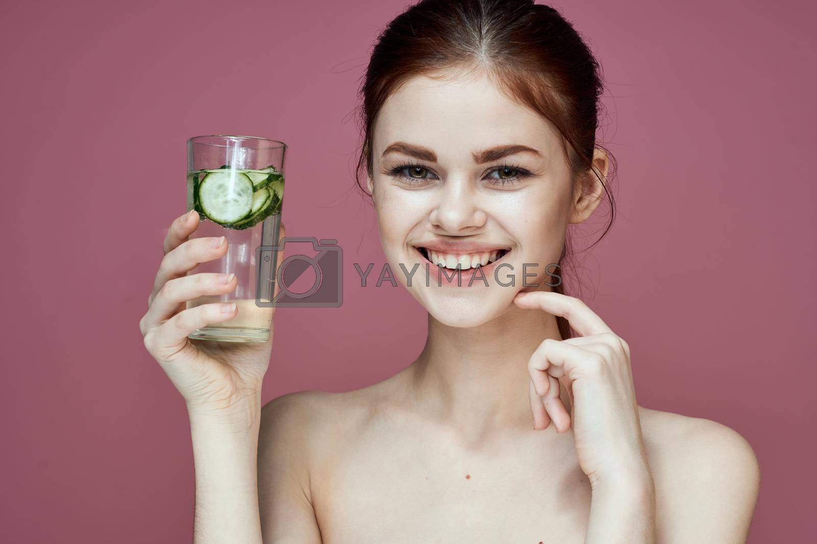 pretty woman with cucumber drink vitamins health beauty. High quality photo