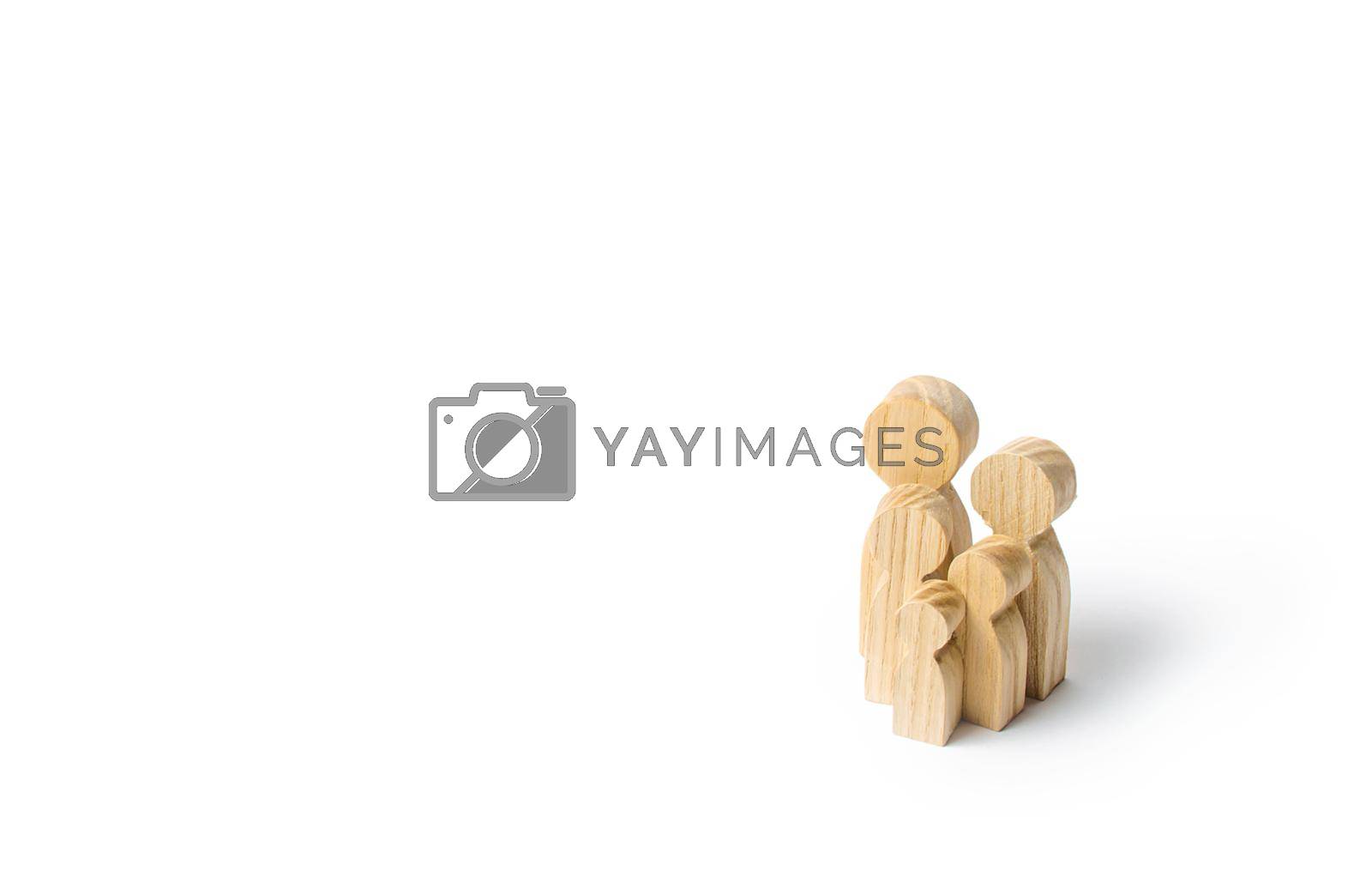 Royalty free image of Wooden figurines of the family on a white background. Family values and health. Adoption and custody of children. Social support, demography, sociology. Upbringing and education. Together concept by iLixe48